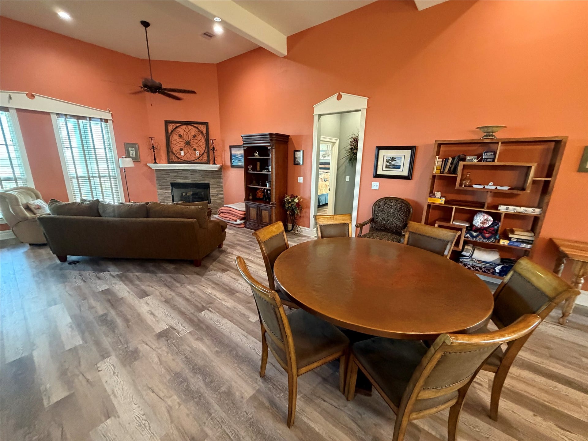 715 Magnolia Lane, Port Bolivar, TX 77650 View of additional dining table and seating area with fireplace