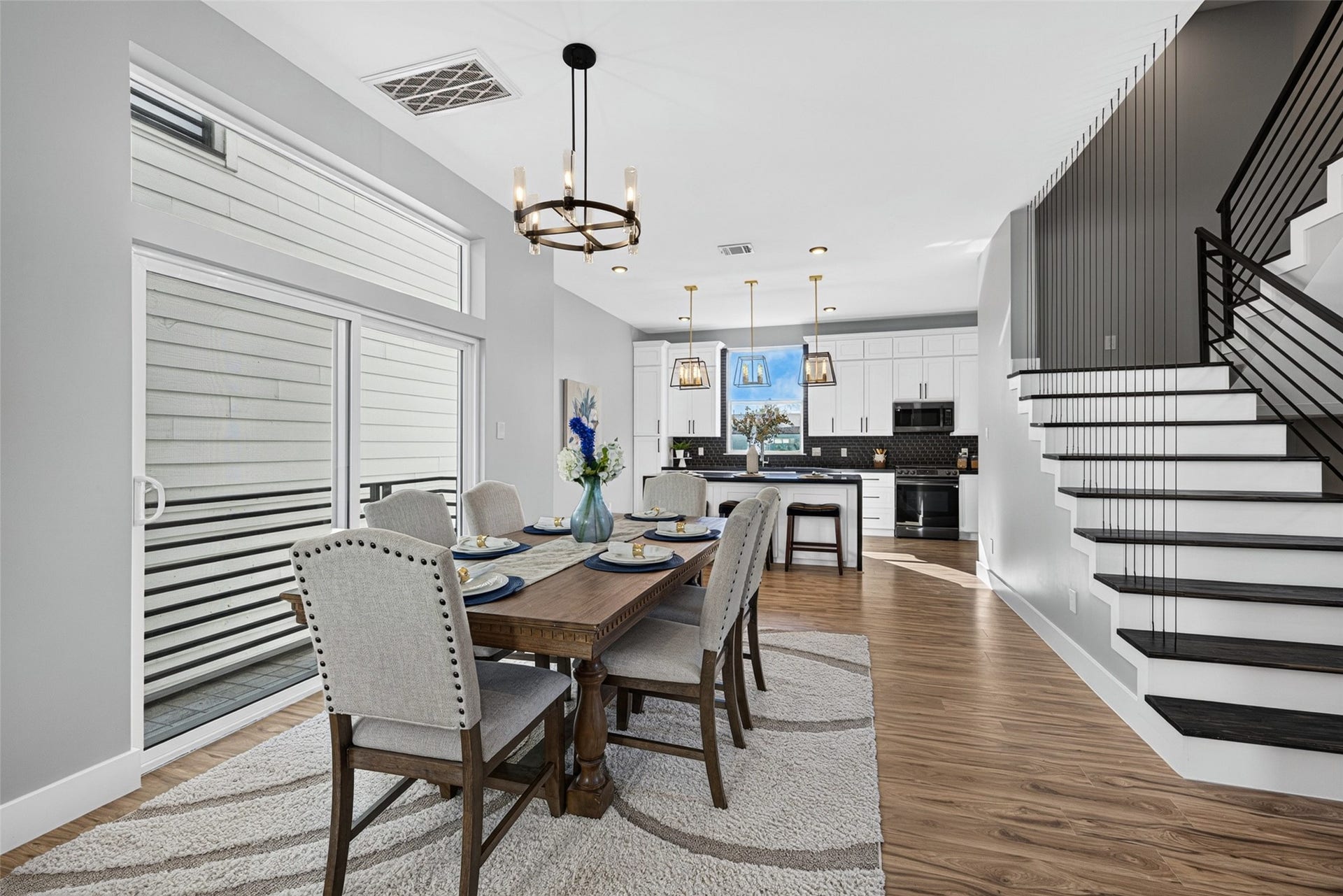 Situated right at the heart of the home, this light-filled dining area seamlessly connects the open kitchen and spacious living room.