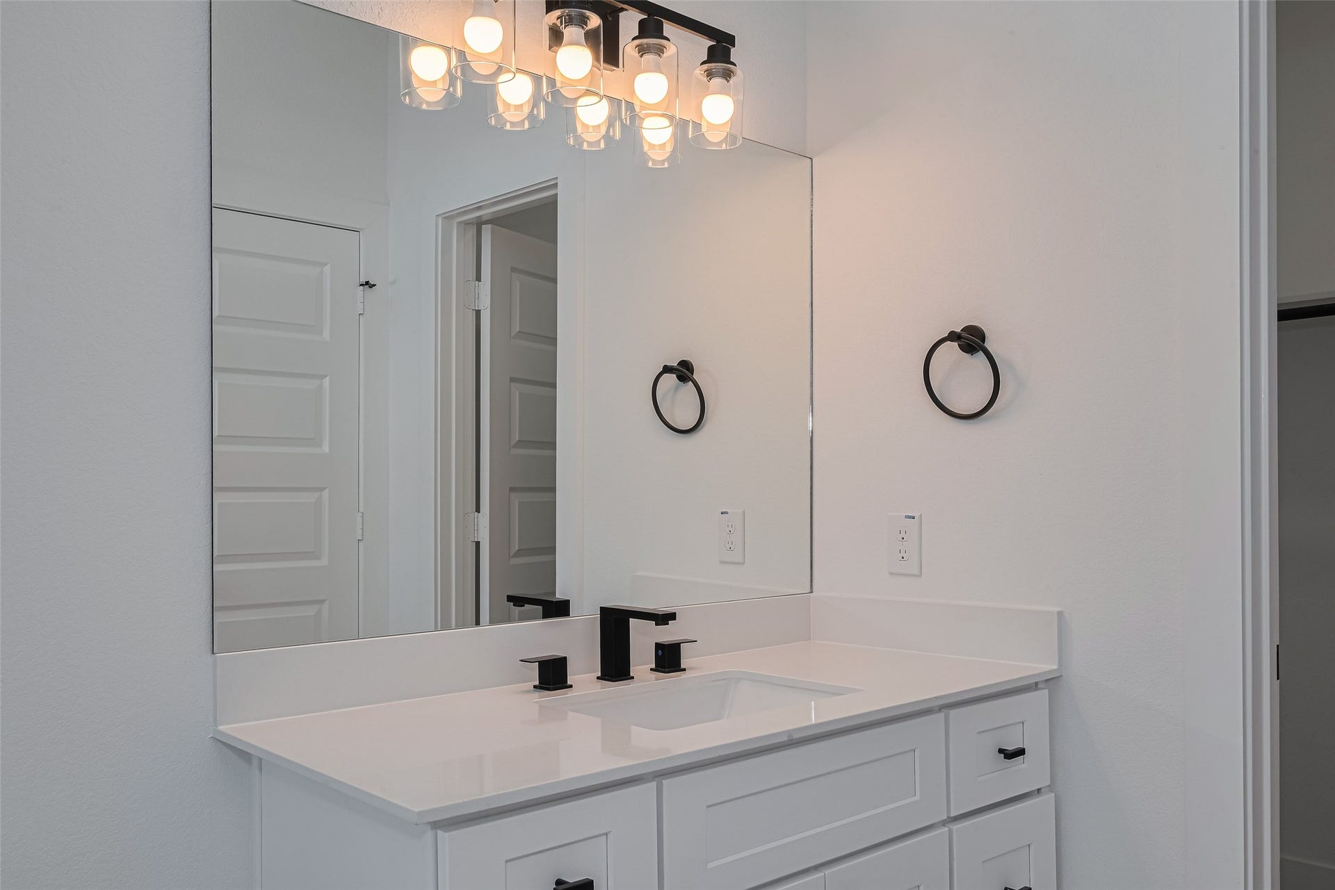 1354 W 24th Street, Houston, TX 77008 Another view of the bathroom highlighting the vanity and contemporary fixtures.