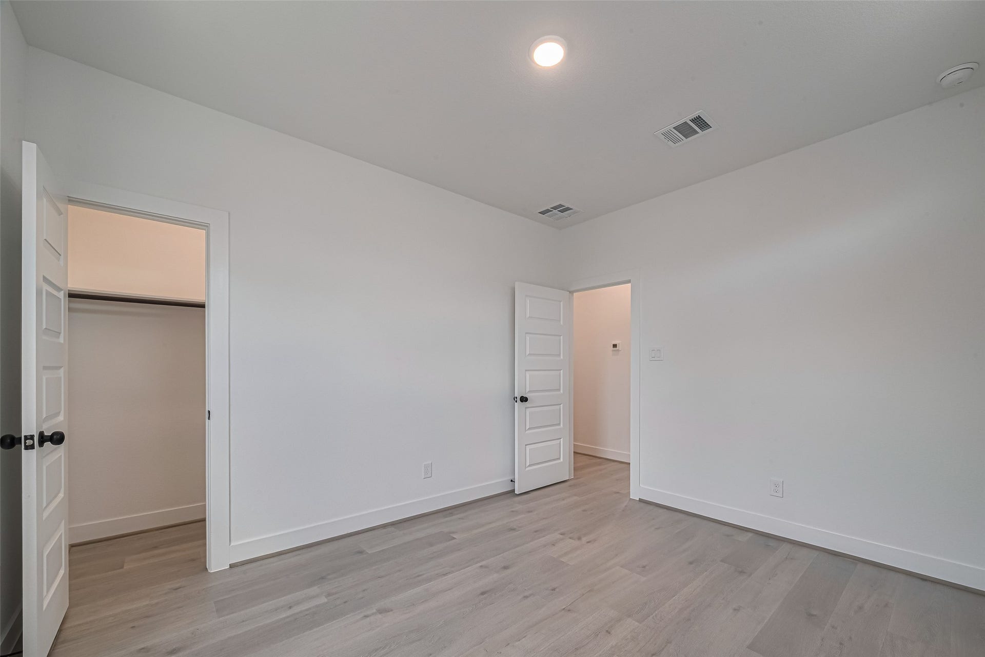 1354 W 24th Street, Houston, TX 77008 Another view of the bedroom showcasing the open layout and closet access.