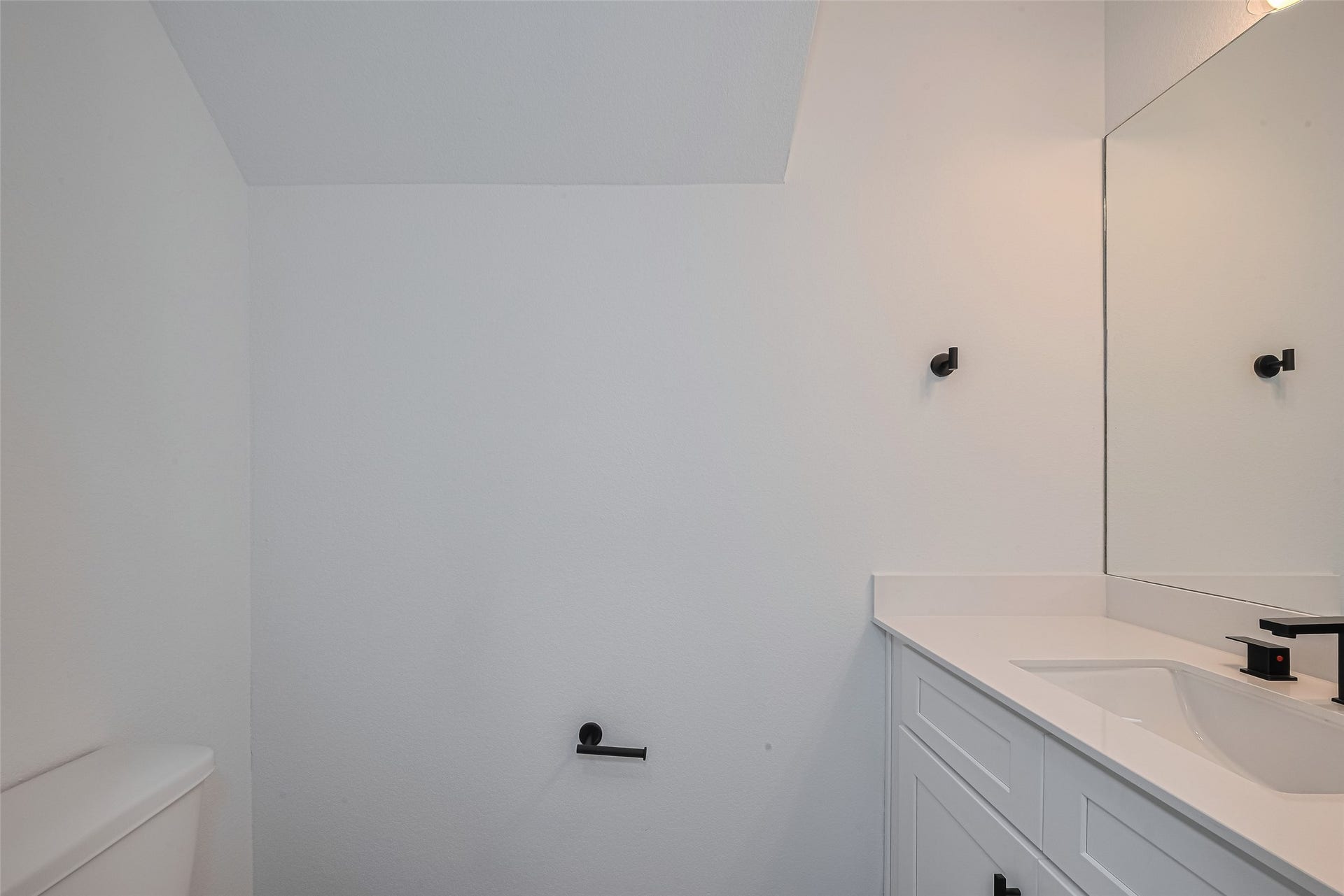 1354 W 24th Street, Houston, TX 77008 Another view of the half bathroom highlighting the simple, clean design.