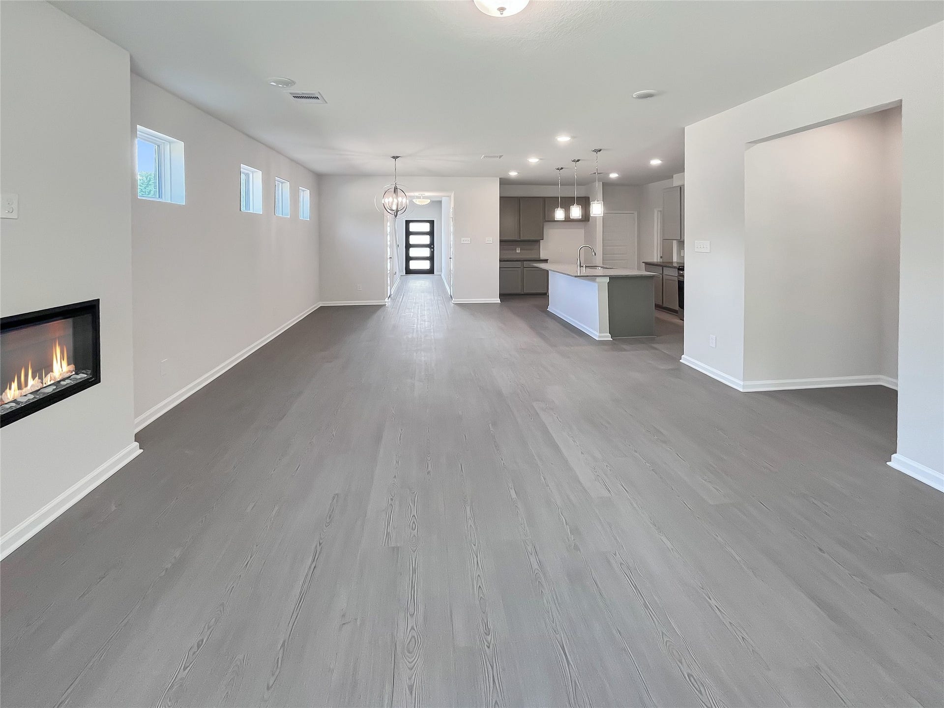 19107 Malatya Court, Montgomery, TX 77316 The Robin II- Family Room, Linear Electric Fireplace not included. Sample image to be used for example only.
