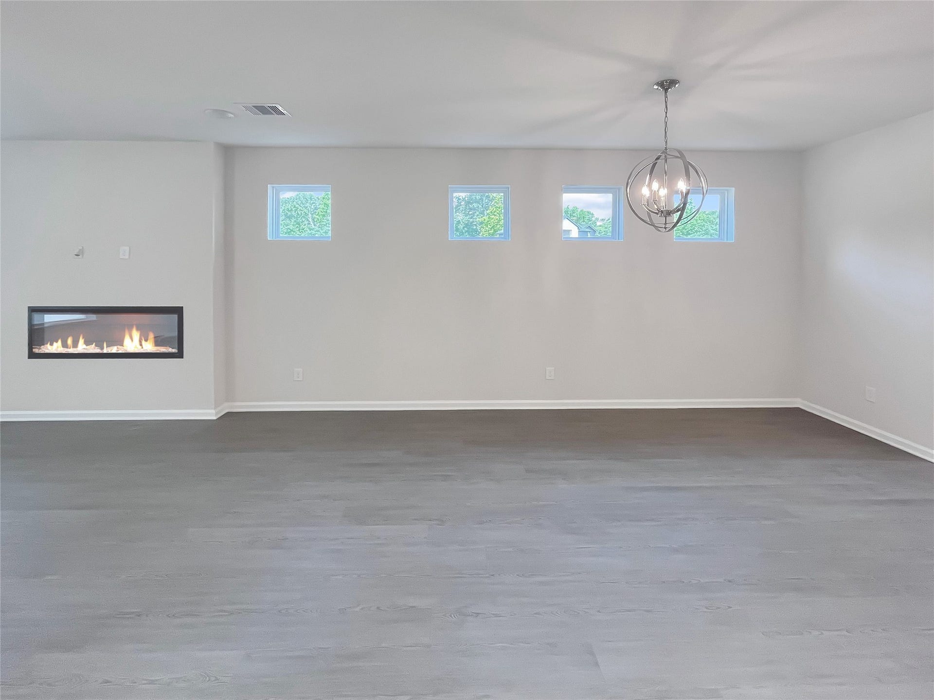 19107 Malatya Court, Montgomery, TX 77316 The Robin II- Family Room, Linear Electric Fireplace not included. Sample image to be used for example only.