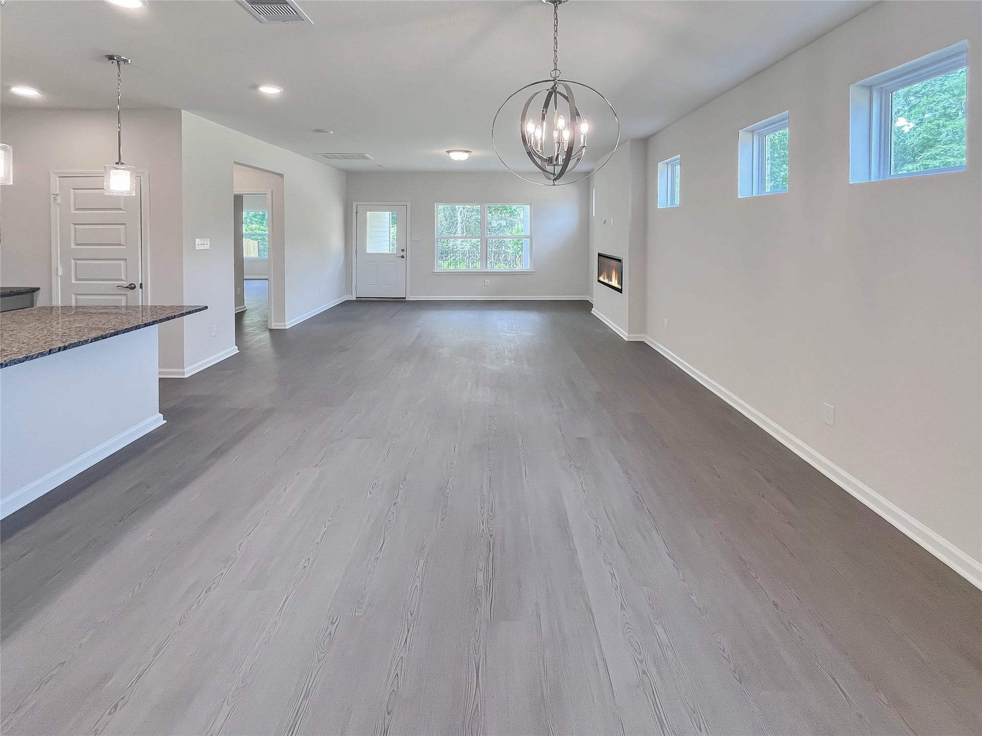 19107 Malatya Court, Montgomery, TX 77316 The Robin II- Dining Area into the Family Room. Sample image to be used for example only.