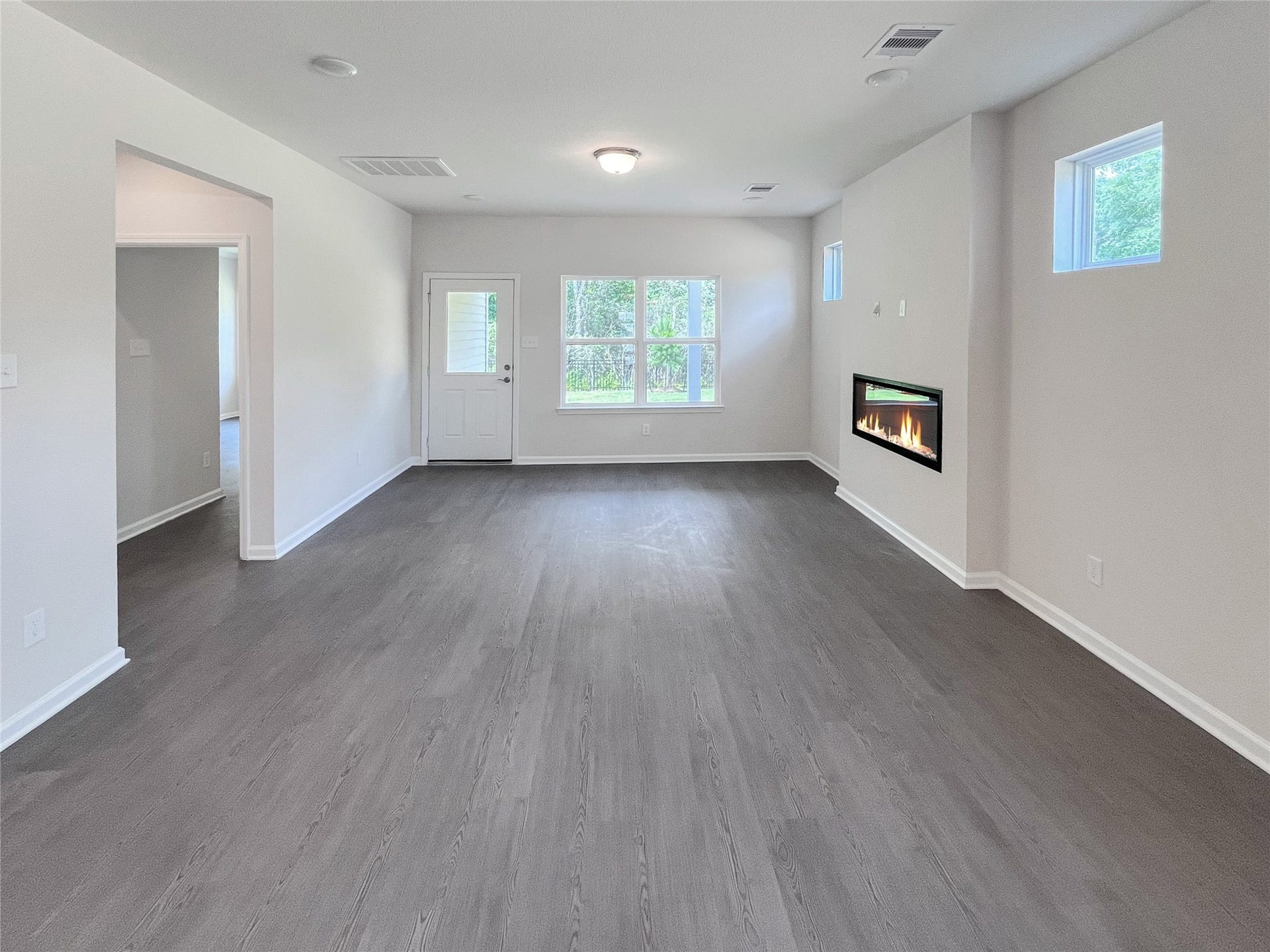 19107 Malatya Court, Montgomery, TX 77316 The Robin II- Family Room, Linear Electric Fireplace not included. Sample image to be used for example only.