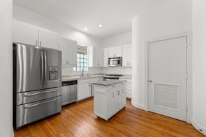 Stackable Washer/Dryer behind this door