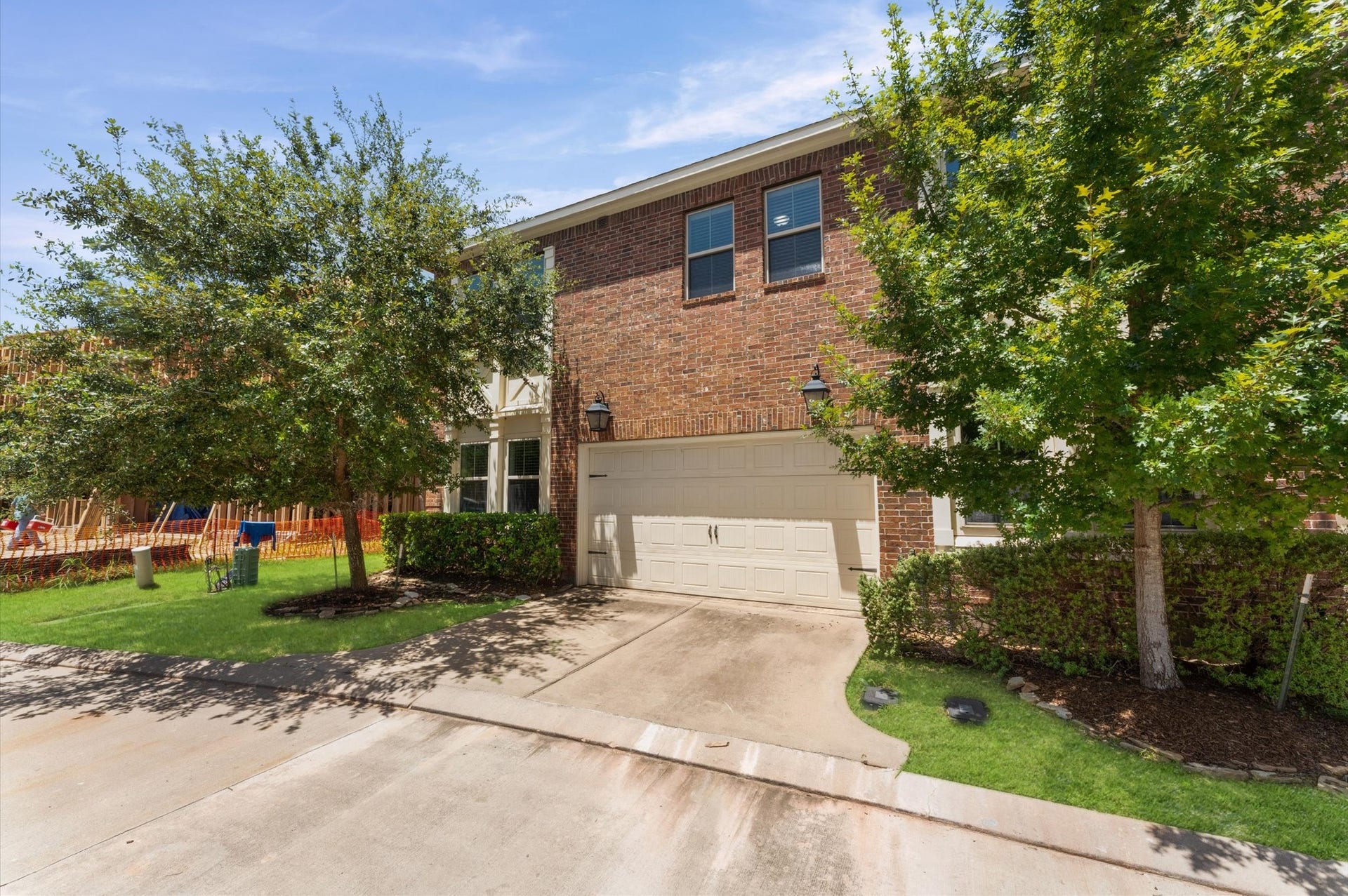 118 Stadium Drive, Sugar Land, TX 77498 Private driveway and two car garage with gated access.