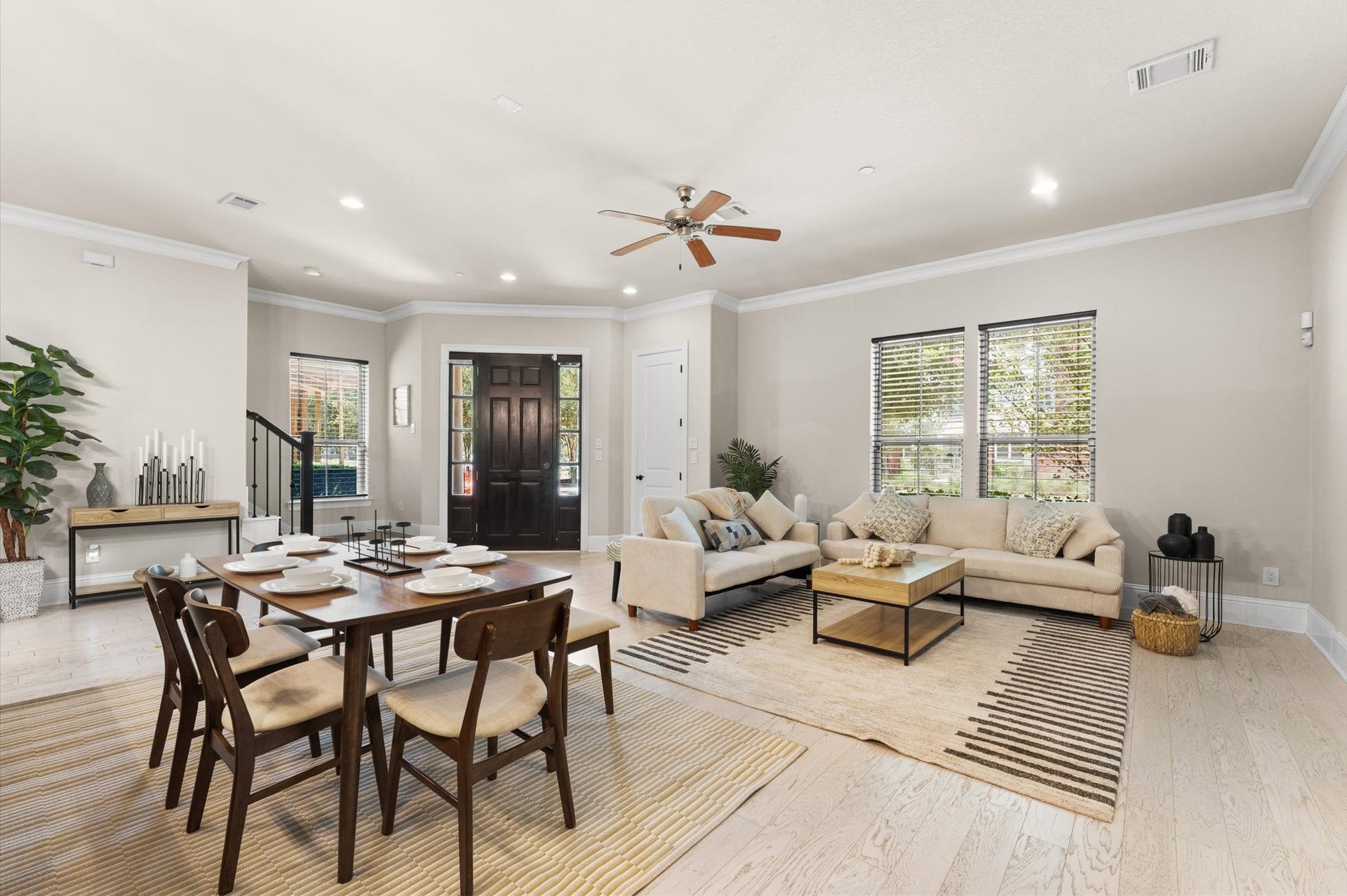 118 Stadium Drive, Sugar Land, TX 77498 Inviting open-plan living area with a cozy seating arrangement, modern dining space.