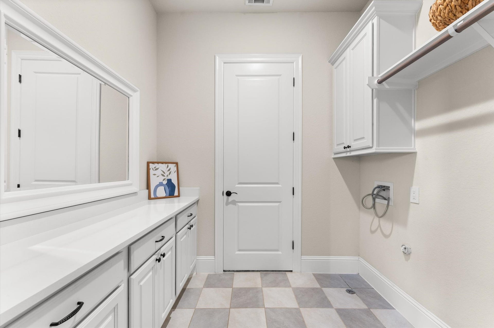 118 Stadium Drive, Sugar Land, TX 77498 Laundry room featuring ample cabinetry, sleek countertops, and contemporary design for a perfect blend of style and functionality.