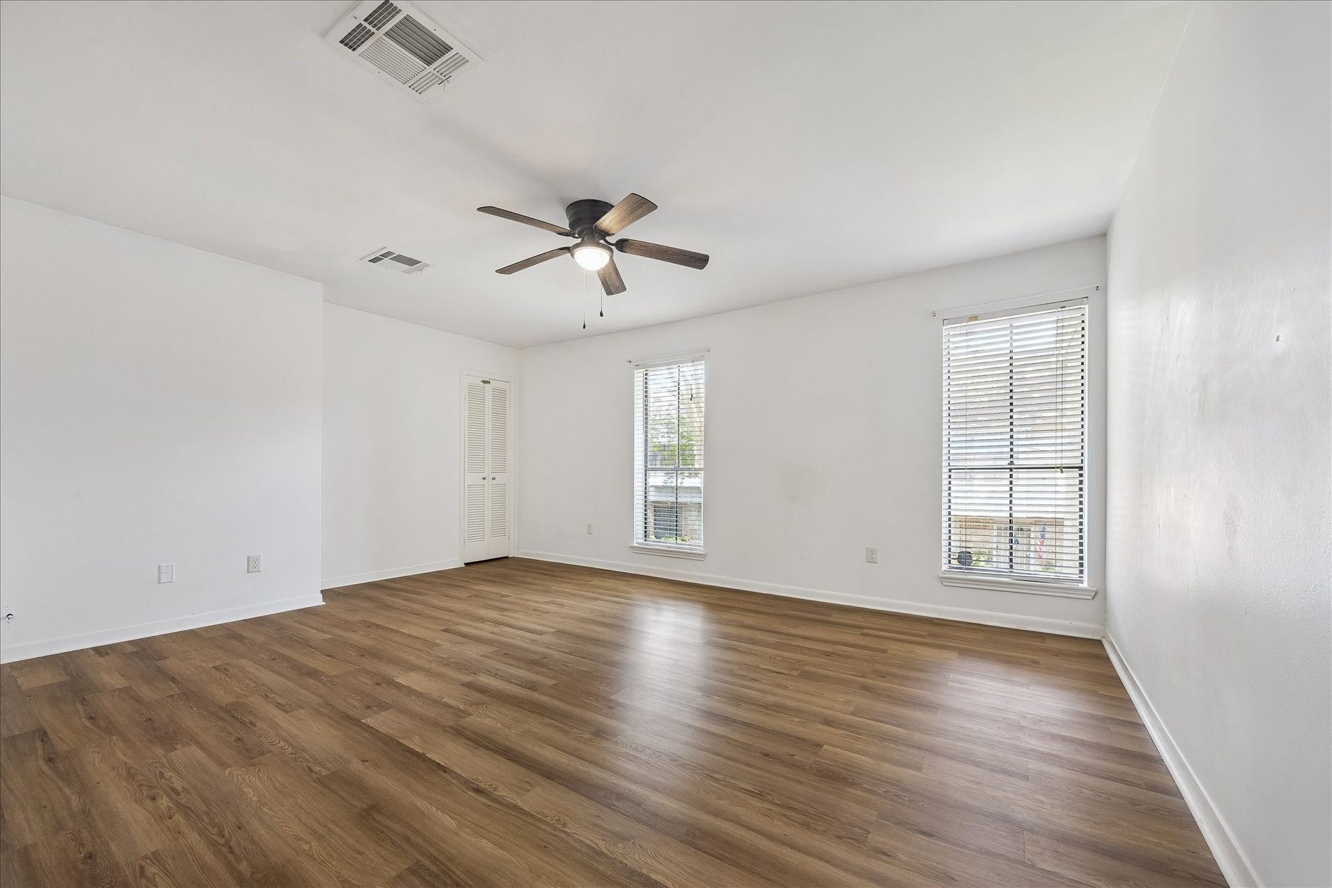 Retreat to the No carpet primary bedroom on the second floor