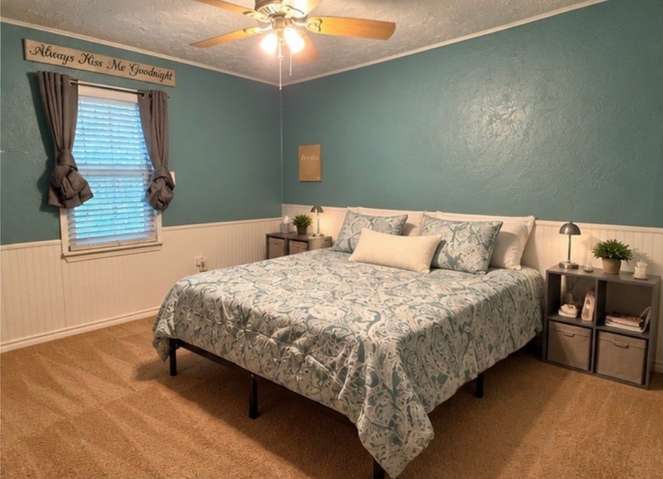 14440 Lakecrest Drive, Splendora, TX 77372 Primary Bedroom Spacious primary bedroom featuring a ceiling fan, neutral carpet and coordinating finishes.