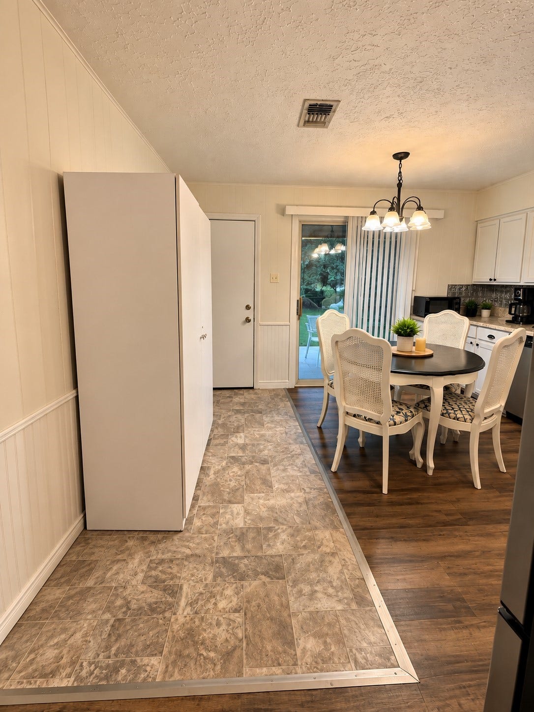 14440 Lakecrest Drive, Splendora, TX 77372 Kitchen & Back Door: Kitchen dining area with easy access to the backyard through the glass patio door and adjacent utility/storage space.