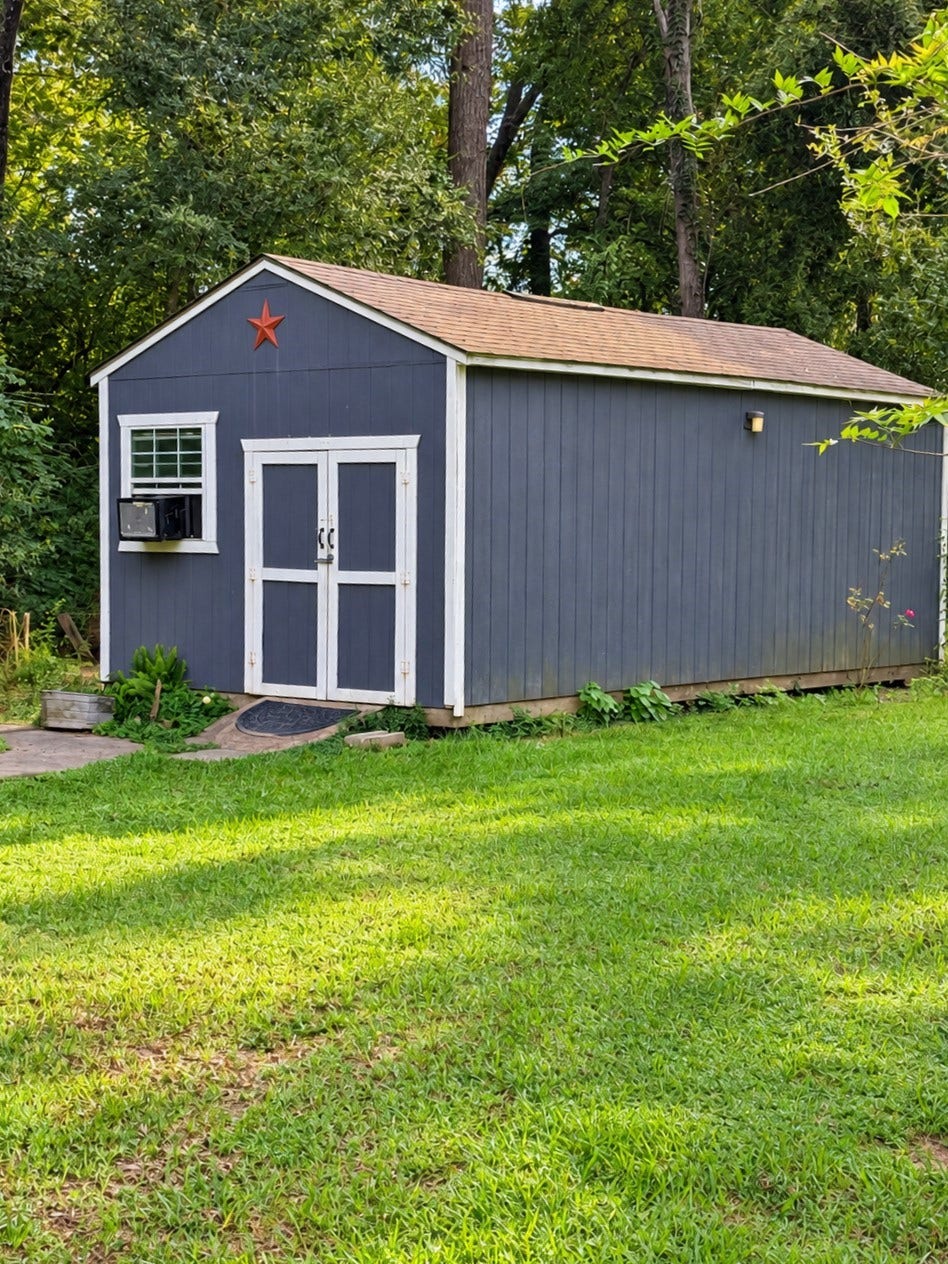 14440 Lakecrest Drive, Splendora, TX 77372 Storage Building Detached storage building with double-door entry, window and ample storage space.