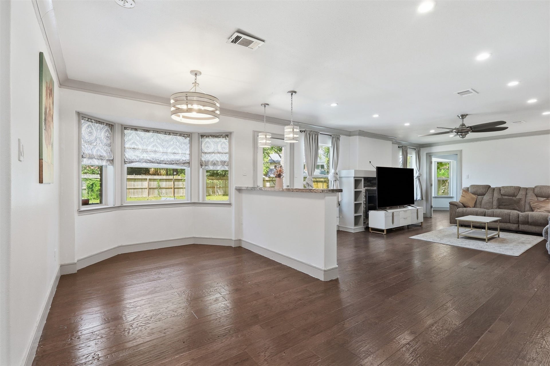6518 Elmgrove Road, Spring, TX 77389 Open-concept living and breakfast area with hardwood floors, abundant natural light, and a seamless flow for everyday living.