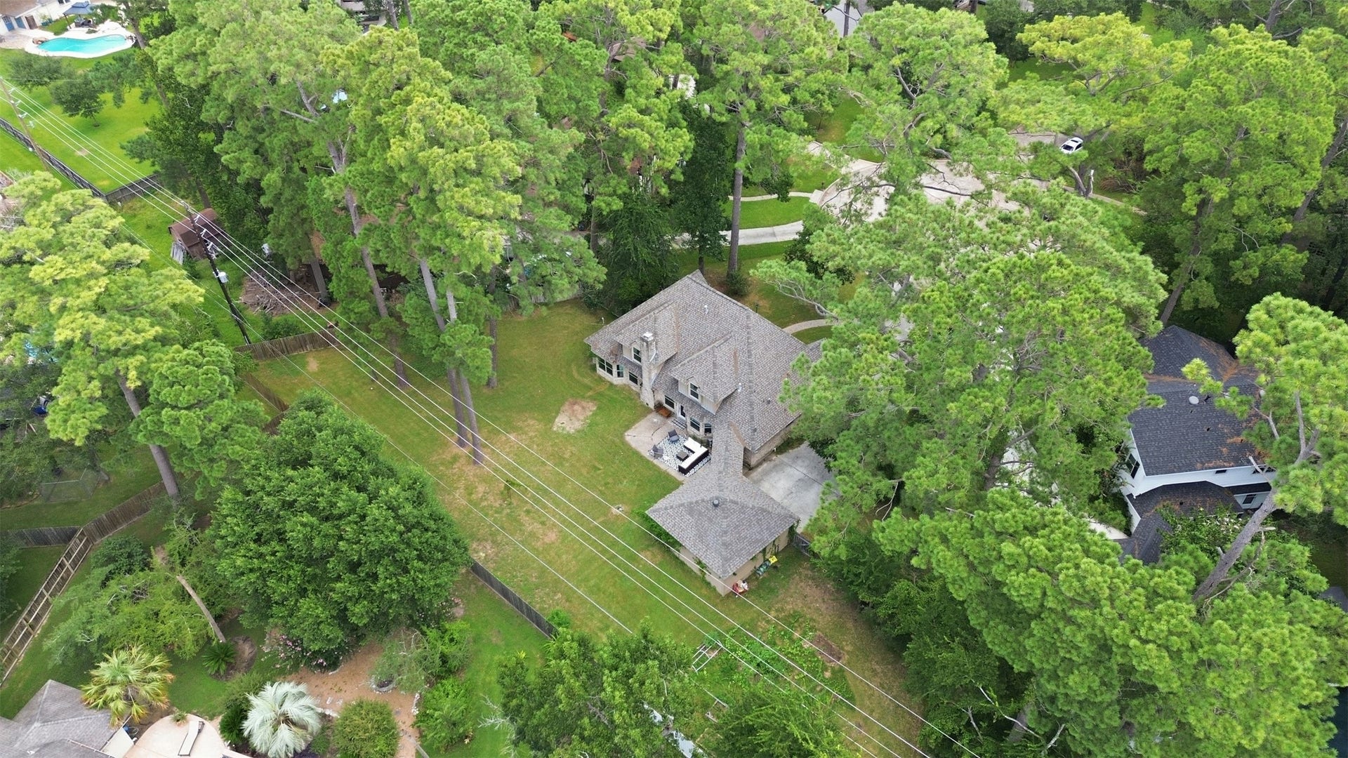 6518 Elmgrove Road, Spring, TX 77389 Aerial view showcasing the expansive, tree-filled lot with an impressive backyard and exceptional outdoor space.