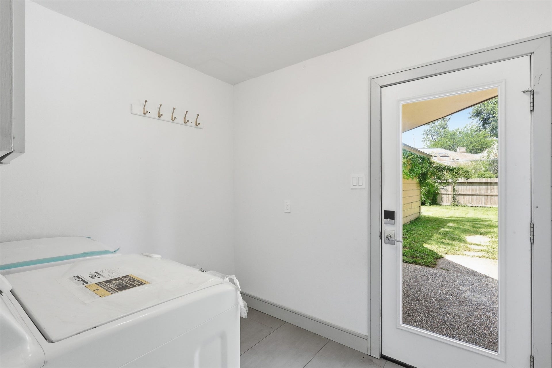 6518 Elmgrove Road, Spring, TX 77389 Convenient laundry room with direct access to the backyard.