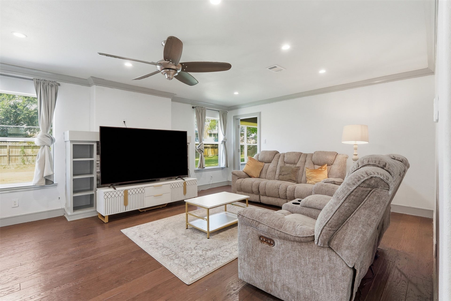 6518 Elmgrove Road, Spring, TX 77389 Spacious living room filled with natural light, featuring hardwood floors and direct access to the backyard.
