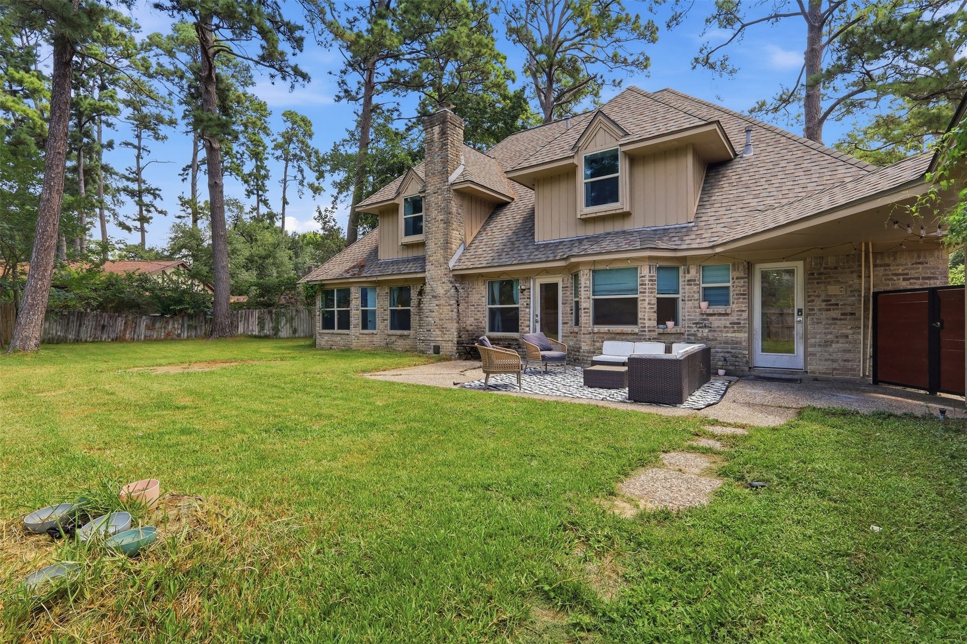 6518 Elmgrove Road, Spring, TX 77389 Expansive backyard surrounded by mature trees, offering incredible space to play, entertain, or create your dream outdoor retreat.