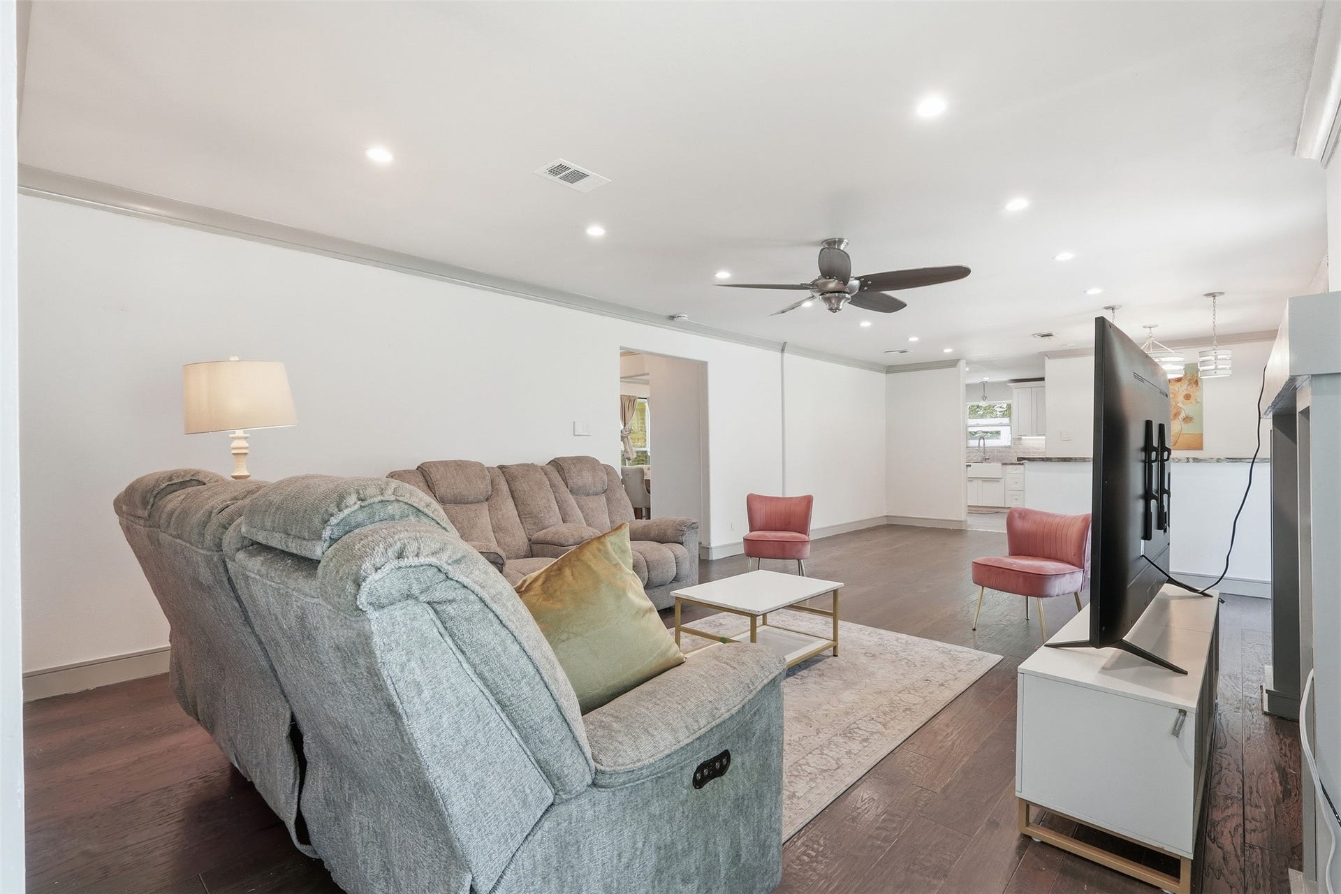 6518 Elmgrove Road, Spring, TX 77389 Expansive living room with hardwood floors and an open flow into the kitchenideal for everyday living and entertaining.