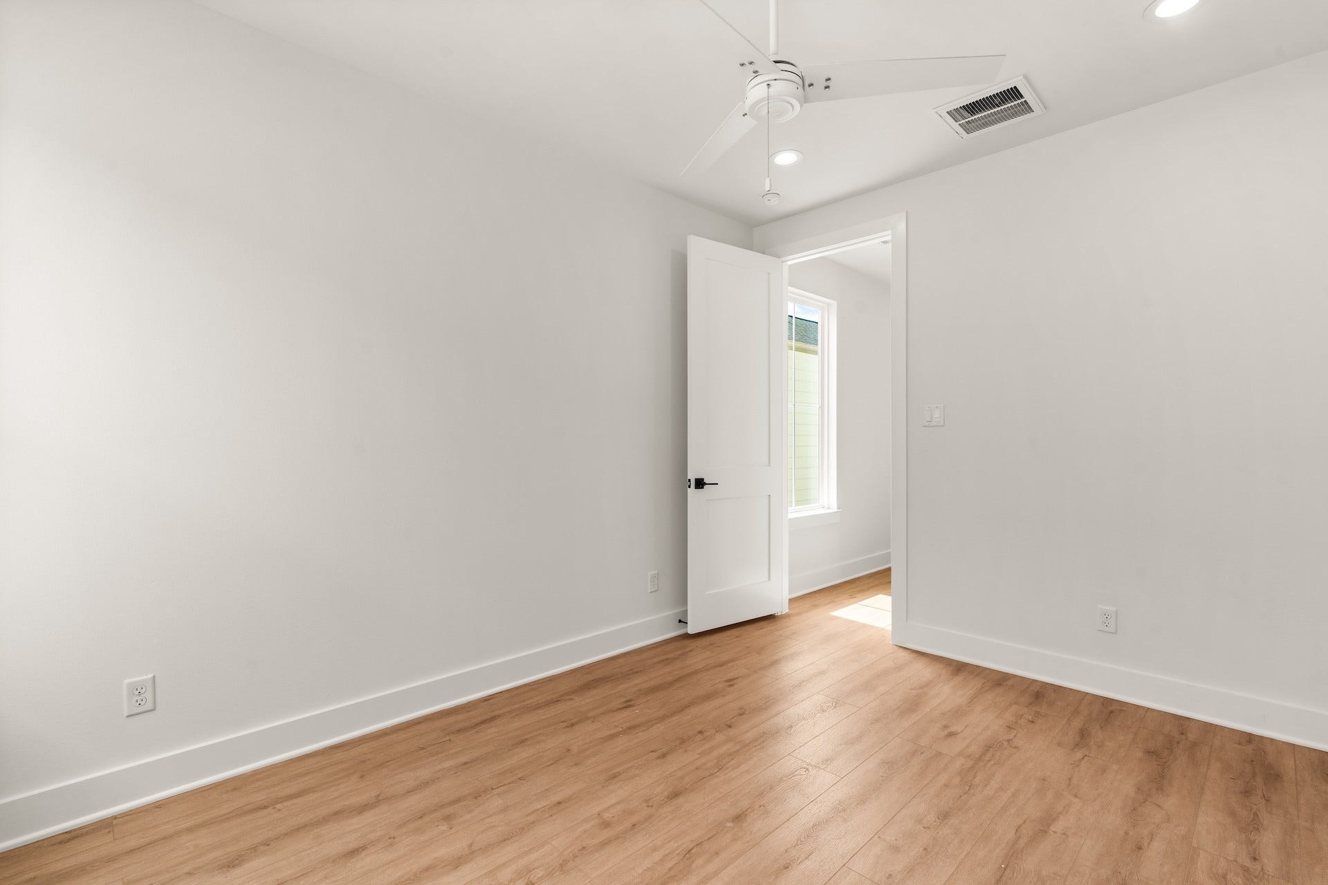 Versatile bedroom layout perfect for a private home office, guest suite, or nursery.