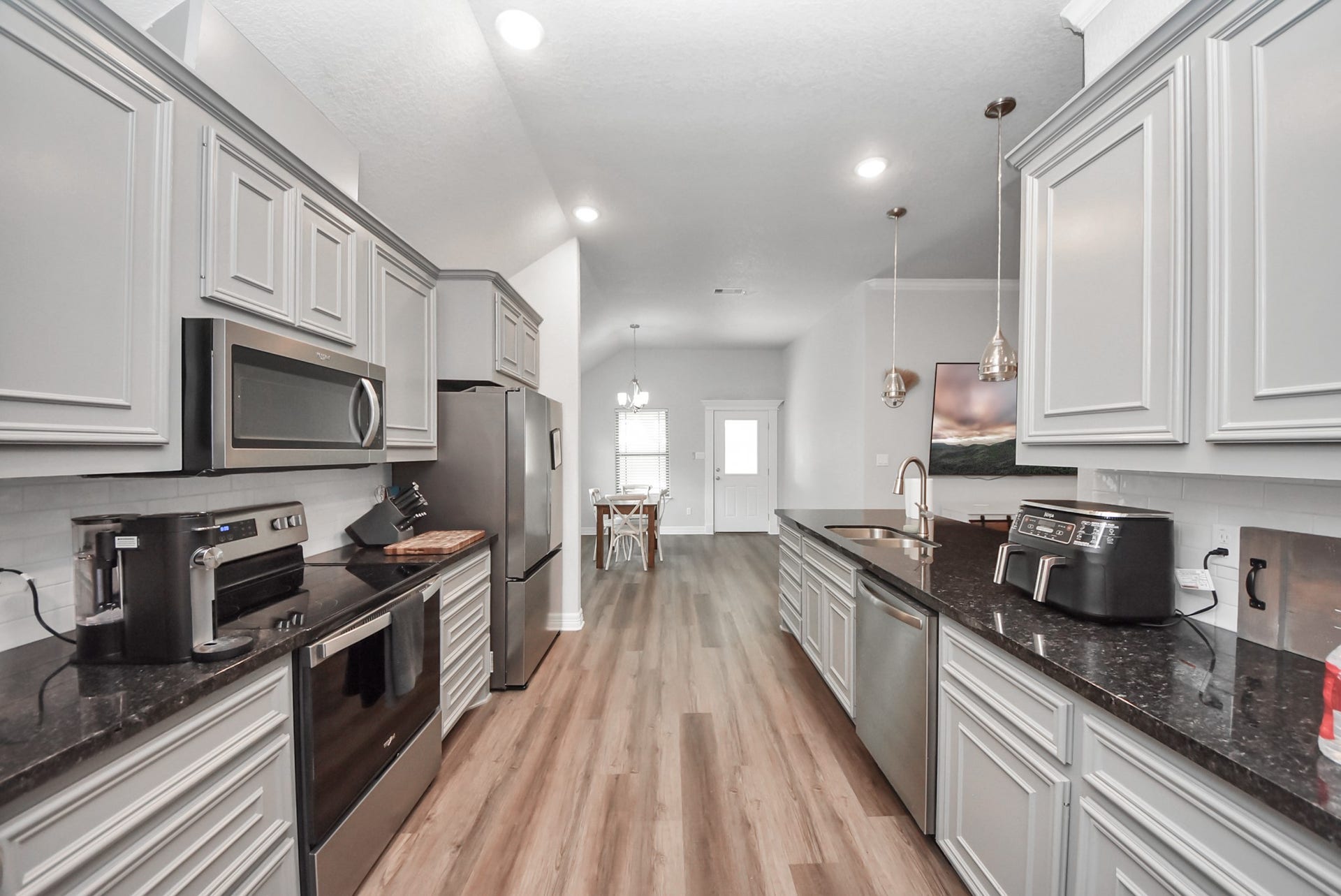 1023 S Anderson Street, Angleton, TX 77515 Beautiful kitchen featuring granite countertops and a functional layout