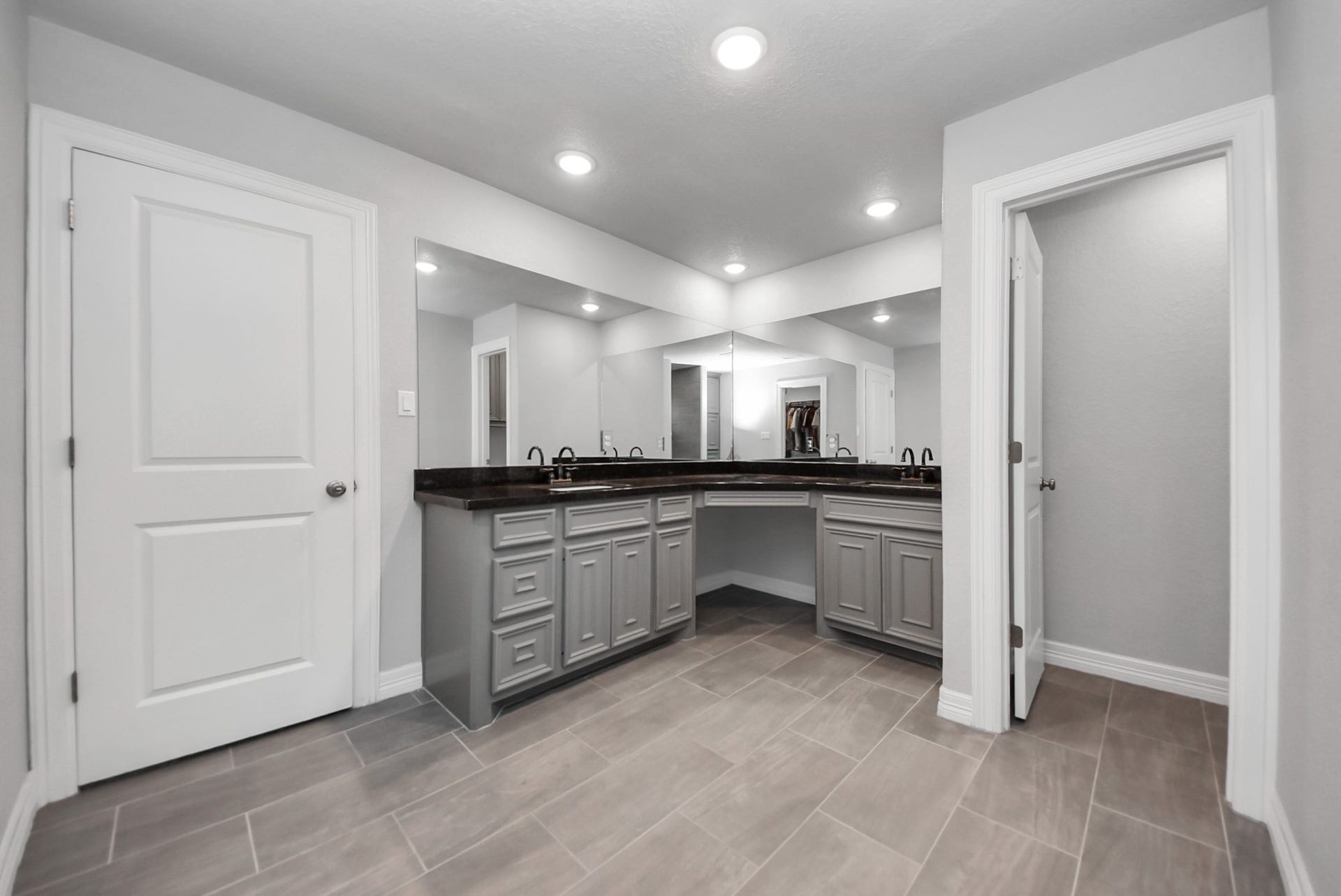 1023 S Anderson Street, Angleton, TX 77515 Primary ensuite with dual vanities offering convenience for daily routines