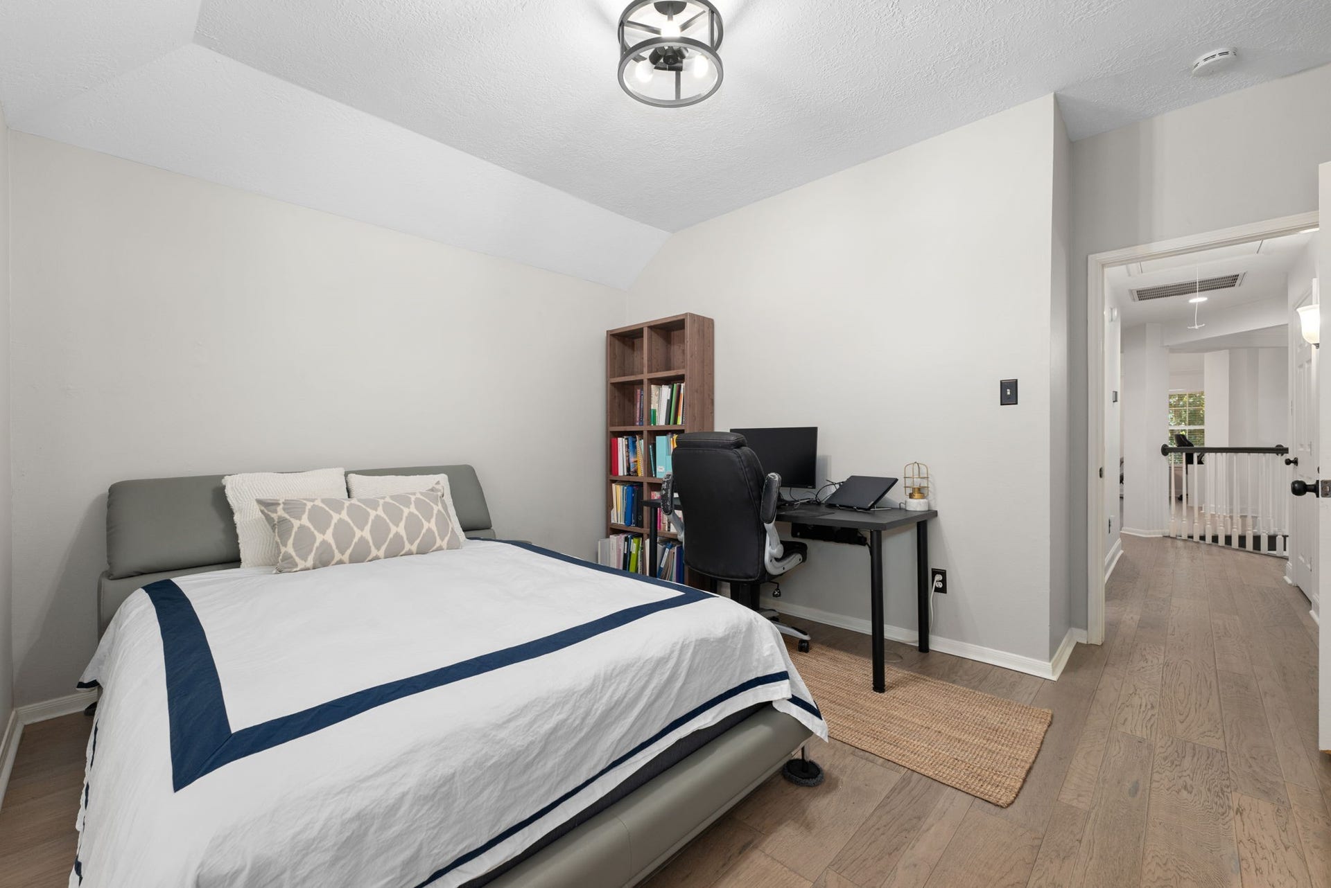26 Cinnamon Teal Place, The Woodlands, TX 77382 Bright and inviting secondary bedroom feature a large bay window and ample apace for rest.