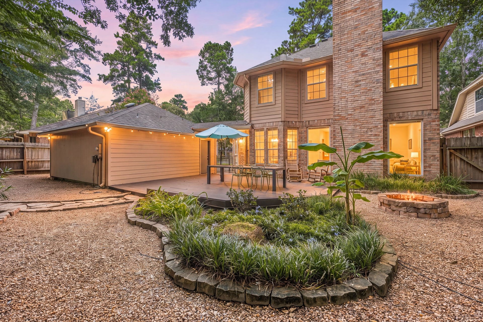 26 Cinnamon Teal Place, The Woodlands, TX 77382 Charming back yard oasis featuring a spacious deck with seating. Surrounded by lush greenery and cozy fire pit.