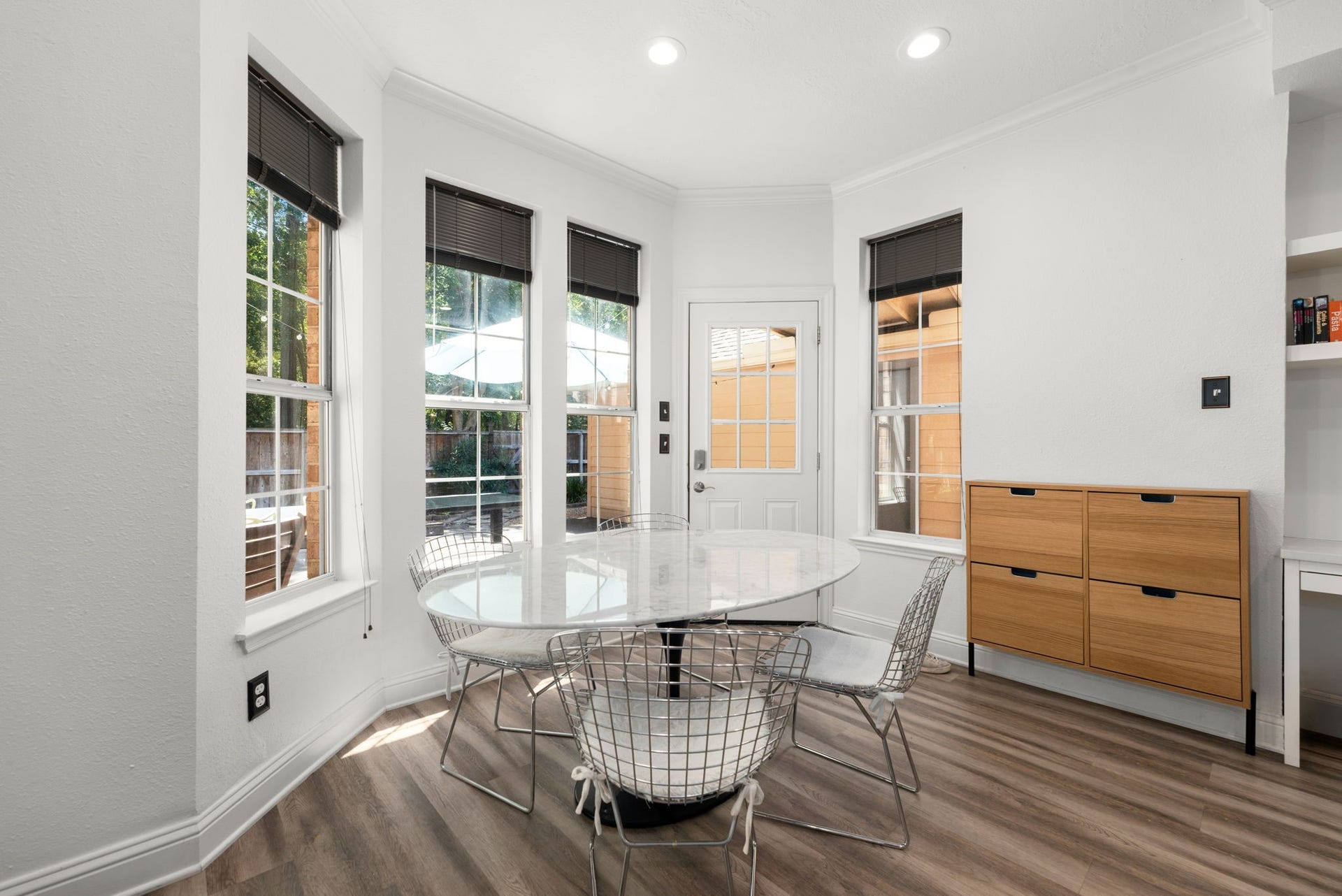 26 Cinnamon Teal Place, The Woodlands, TX 77382 Bright breakfast room with large window, perfect for casual dining.