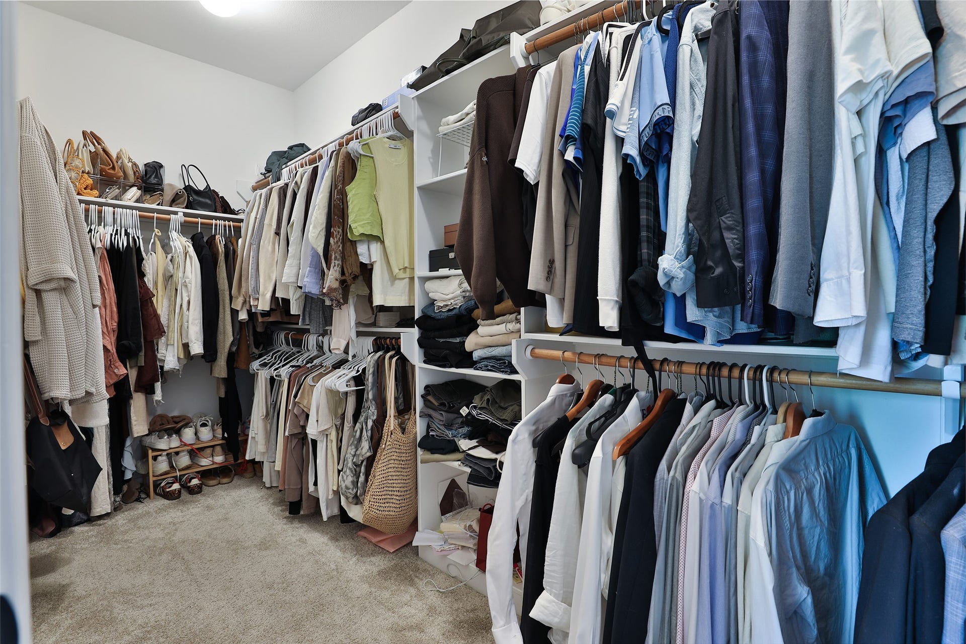 1112 Bingham Street, Houston, TX 77007 Spacious walk-in closet with ample shelving and hanging space, perfect for organizing clothing and accessories.