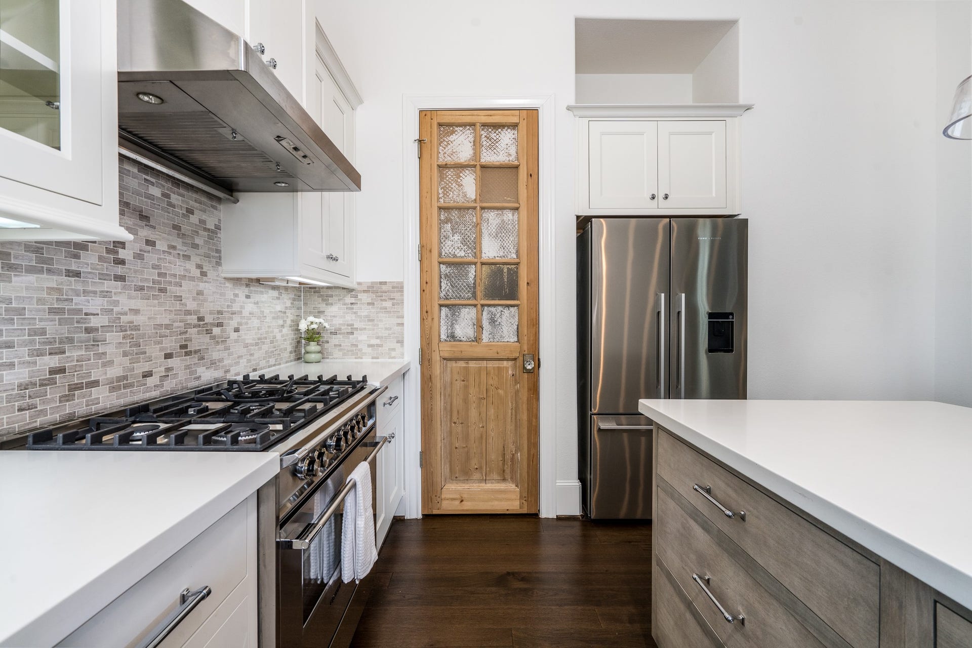 8624 Emnora Lane, Houston, TX 77080 This pantry door is just one of the elegant design elements that make this kitchen special.