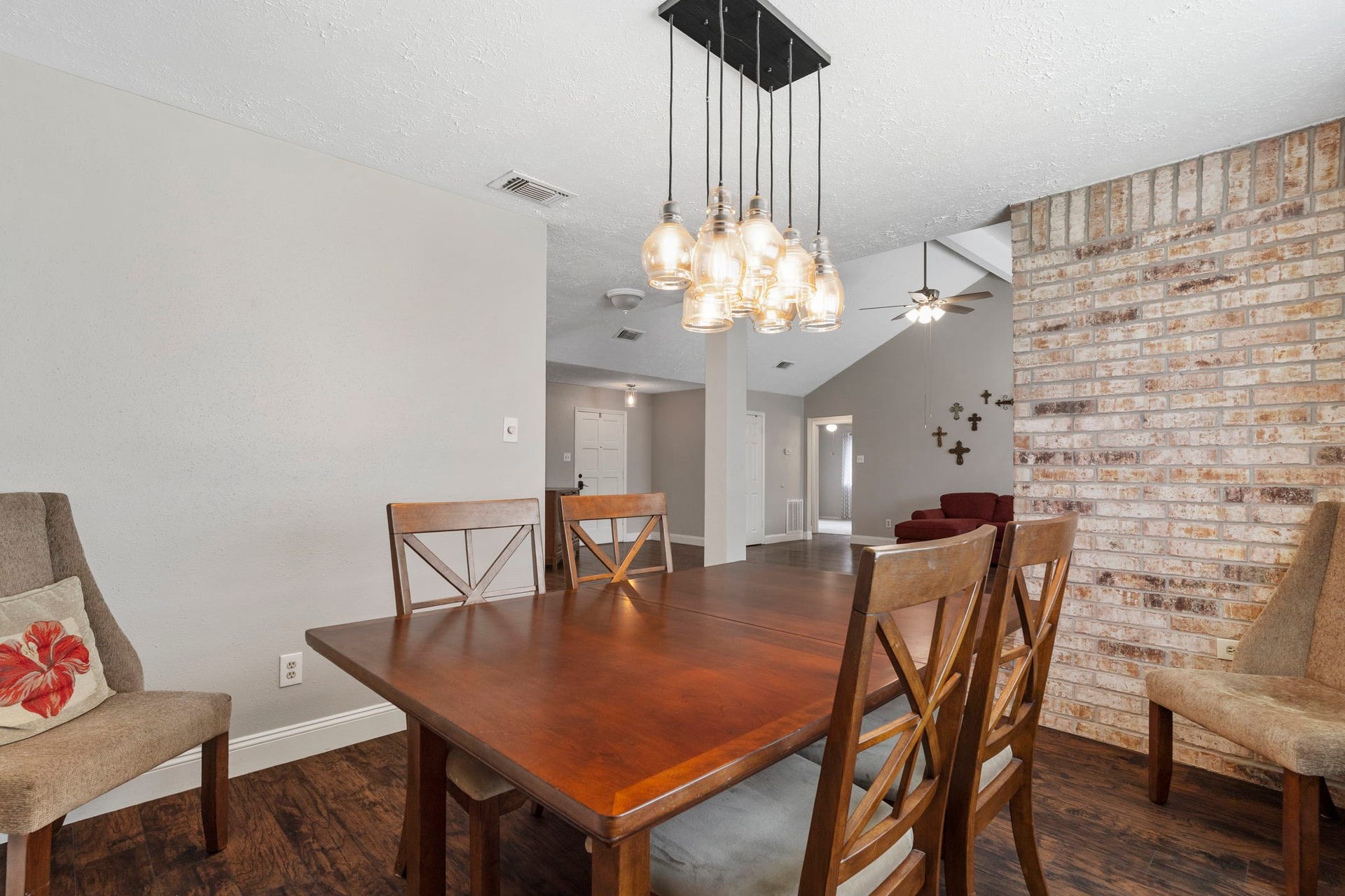 2437 Willow Bend Drive, Richmond, TX 77406 Another view of the elegant dining area showcasing the brick accents from the fireplace.