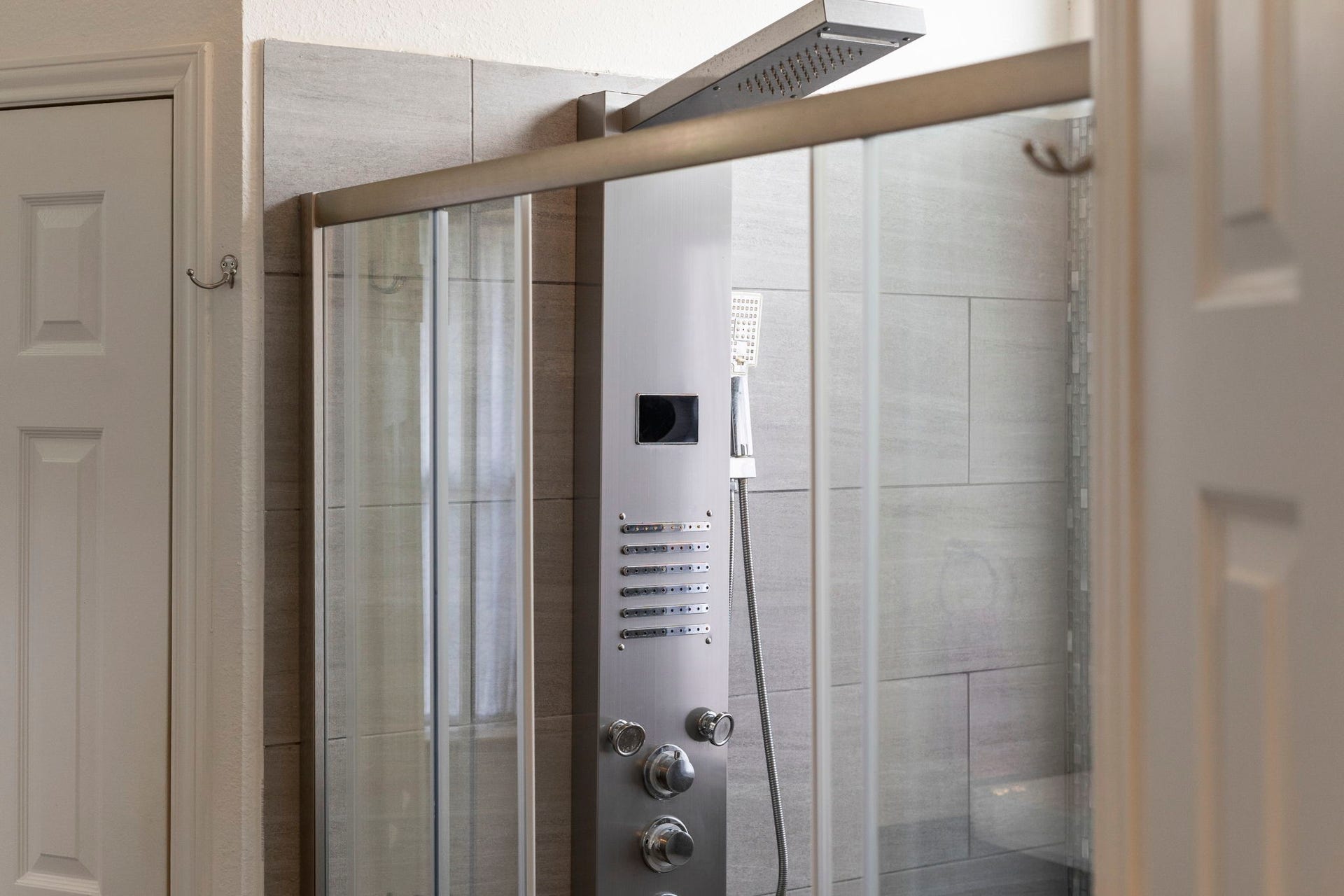 2437 Willow Bend Drive, Richmond, TX 77406 The primary bathroom shower with modern fixtures and sleek glass doors, offering a luxurious and refreshing experience.