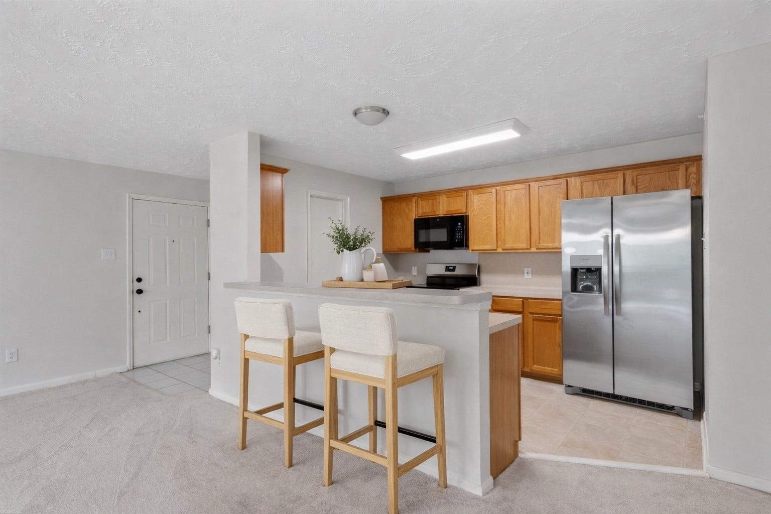 8051 Bay Branch Drive, #423, The Woodlands, TX 77382 Kitchen with a breakfast bar