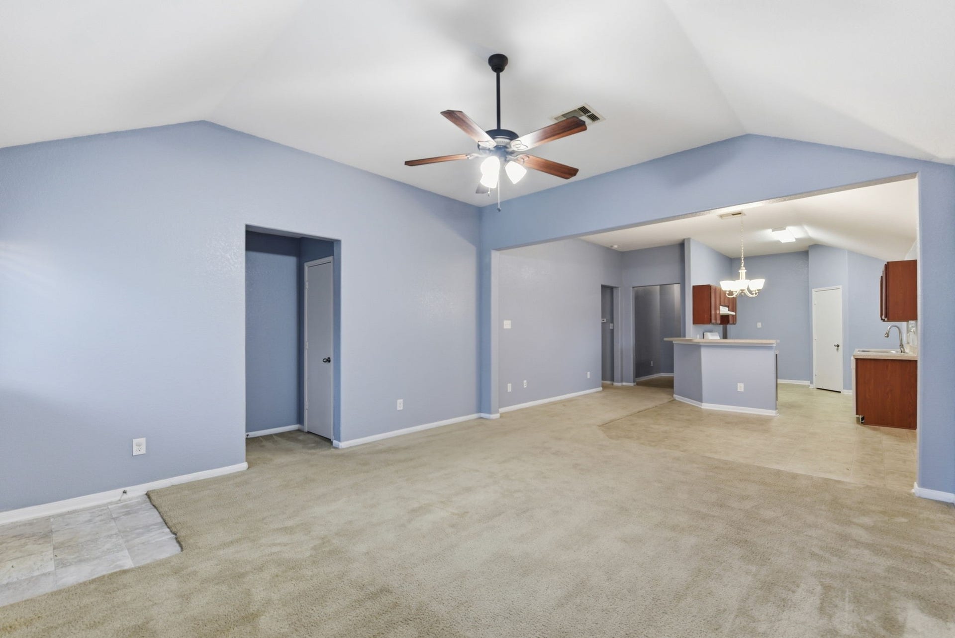 16763 N Blue Jay Lane N, Conroe, TX 77385 Bright, open-concept living space with entry into the primary suite.