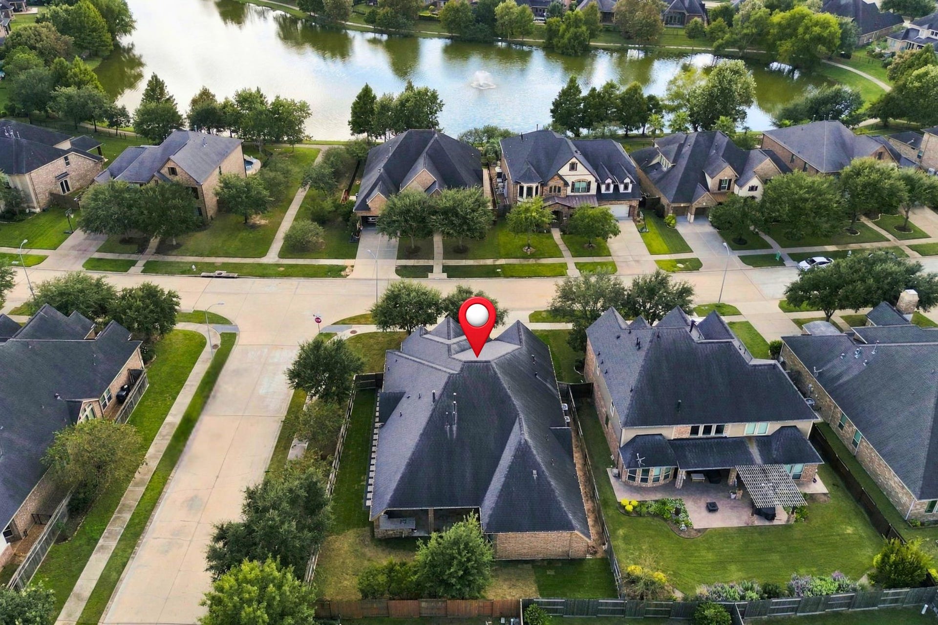 27302 Liberty Heights Lane, Fulshear, TX 77441 Conveniently located across the street from one of the neighborhood's many lakes, this home also offers easy access to Randolph Elementary School, shopping, and grocery stores, making everyday errands and school drop-offs a breeze.
