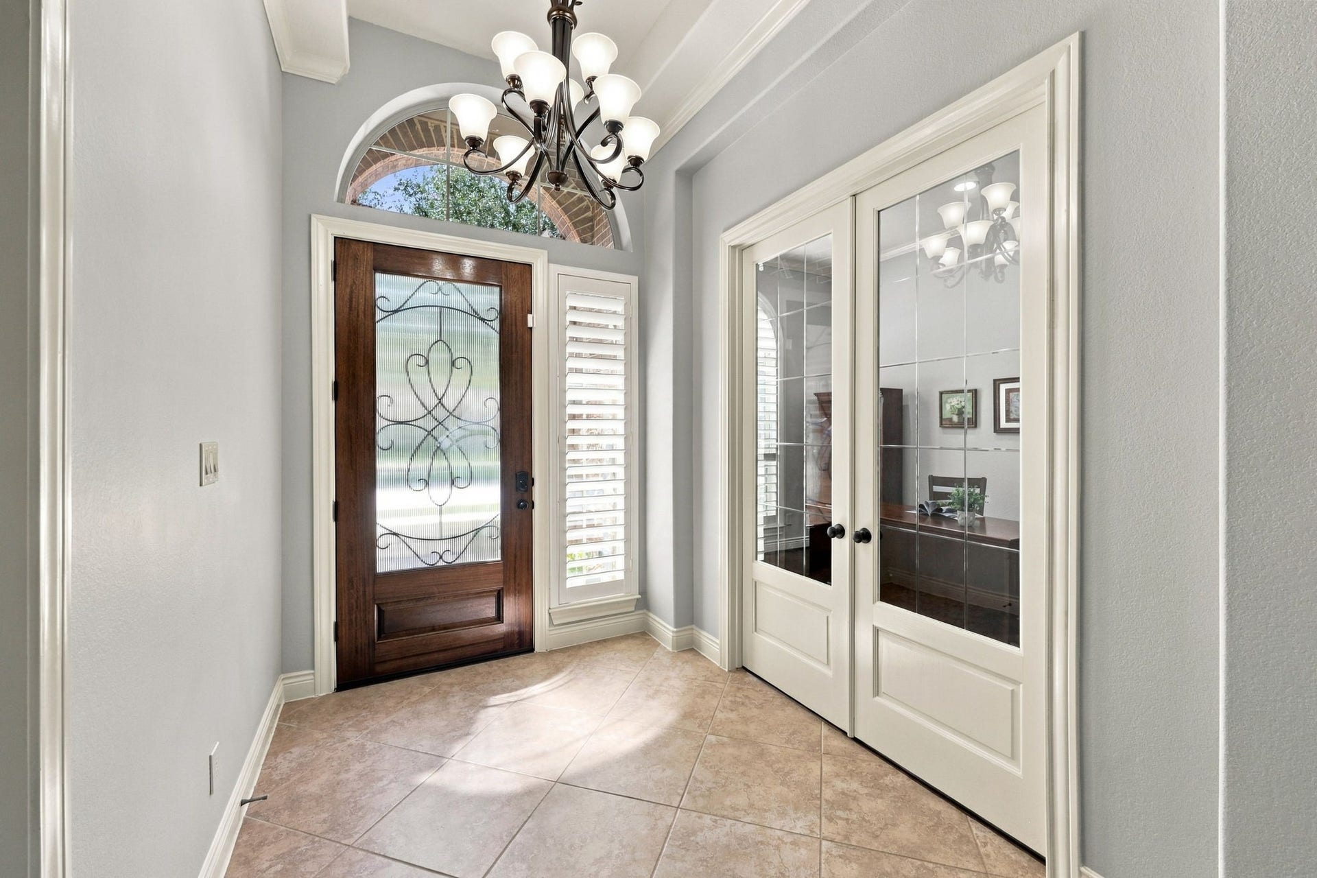 27302 Liberty Heights Lane, Fulshear, TX 77441 Located at the front of the home, the private Home Office is accessed through elegant double glass doors, offering a quiet and dedicated space for working from home or managing daily tasks.