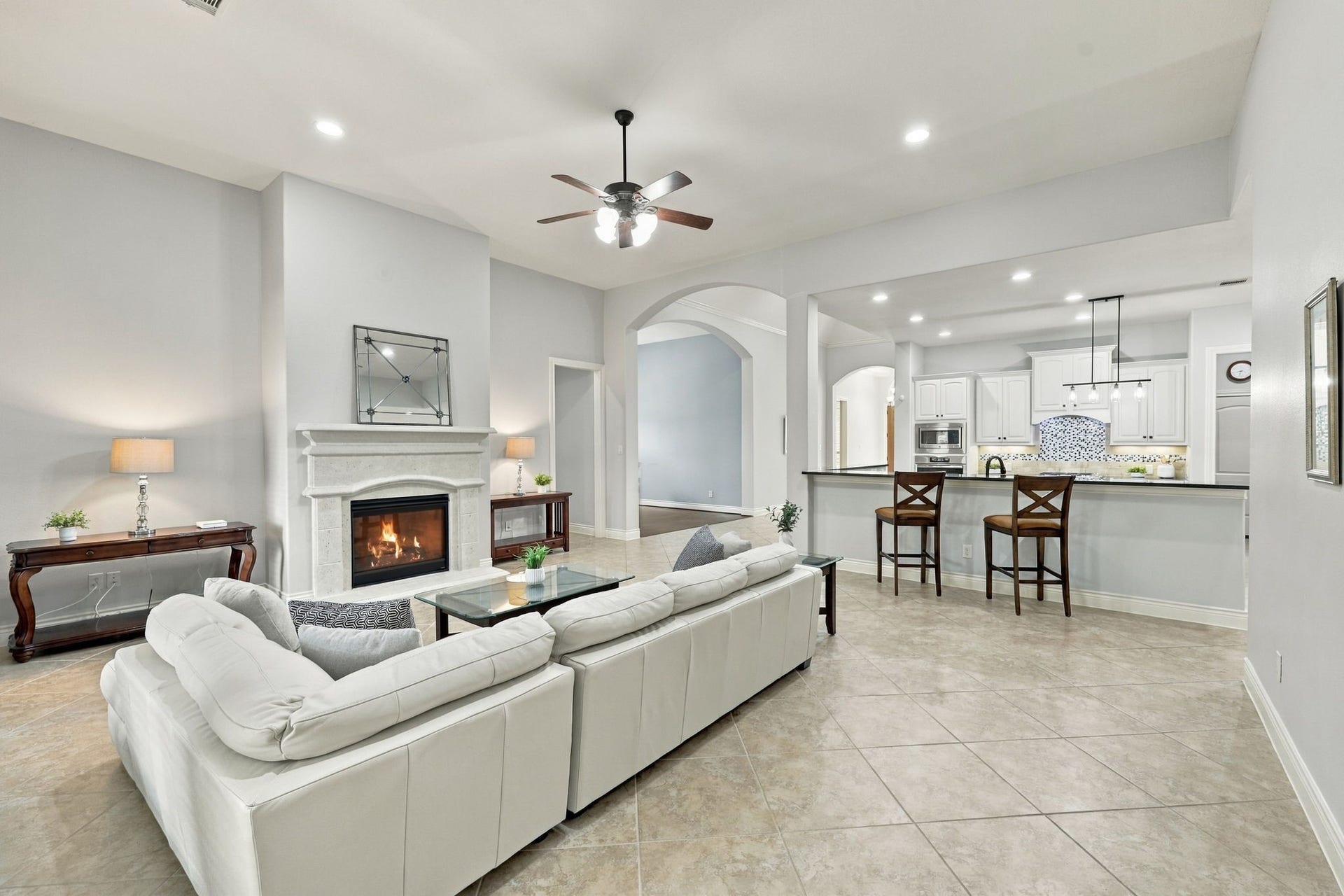 27302 Liberty Heights Lane, Fulshear, TX 77441 This view from the opposite side of the Family Room highlights the spacious depth of the room and the easy, open flow into the Kitchen, creating an ideal layout for everyday living and entertaining.