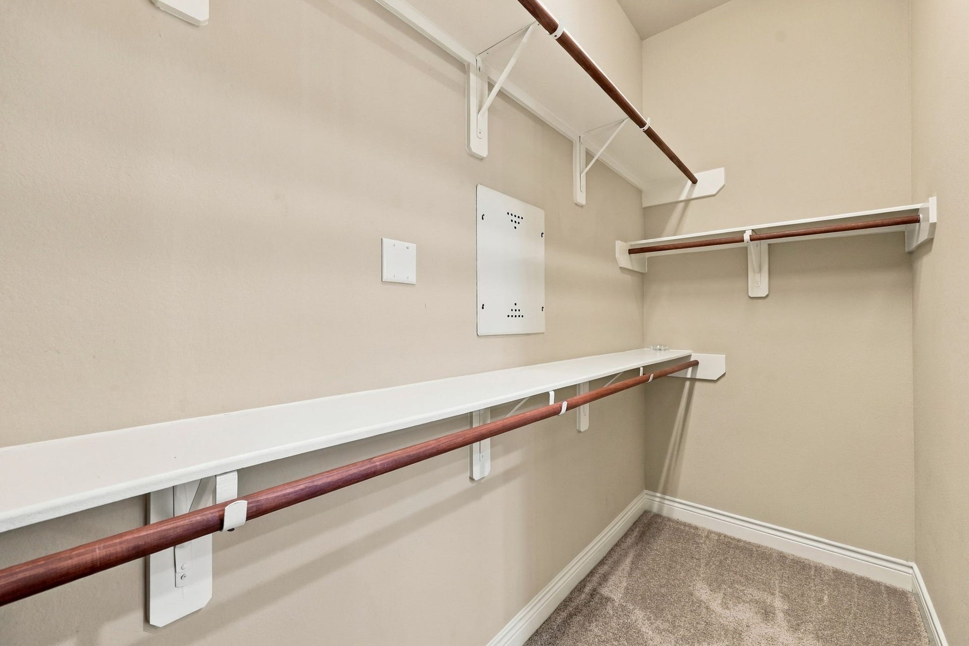27302 Liberty Heights Lane, Fulshear, TX 77441 The Primary Bathroom offers two separate walk-in closets for added storage and organization. This spacious closet is the second of the two, providing ample room for clothing, shoes, and accessories.