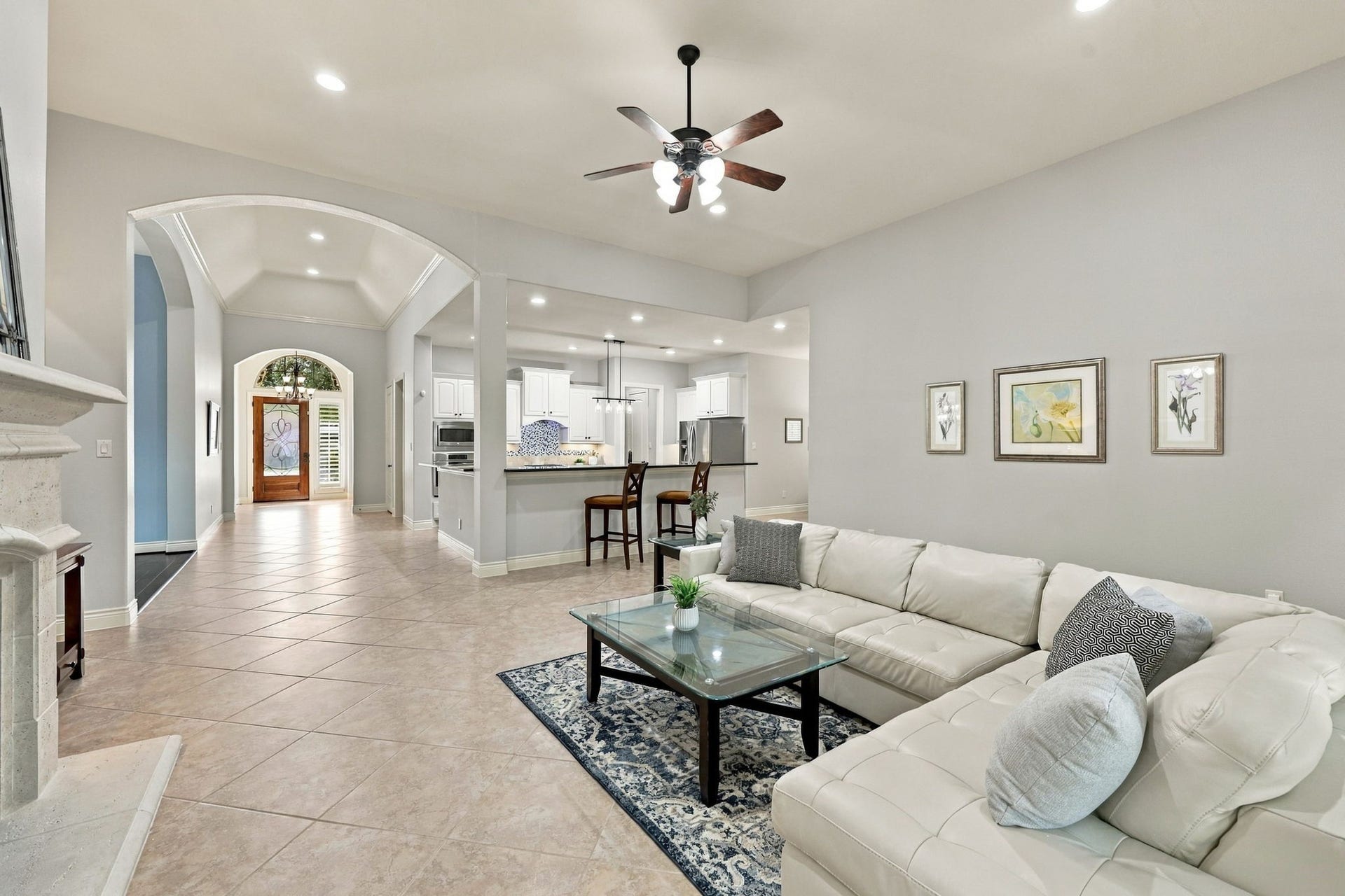27302 Liberty Heights Lane, Fulshear, TX 77441 This view from a different angle looks back toward the front Foyer and Kitchen, highlighting the home's open layout and the seamless flow between the main living spaces.