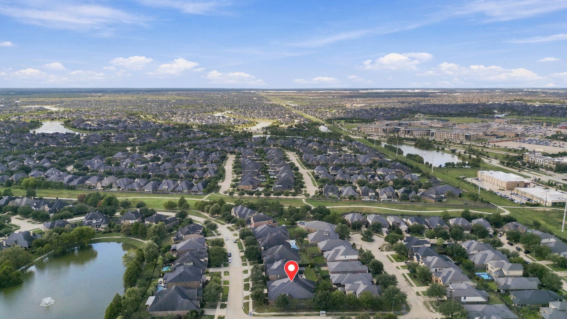 27302 Liberty Heights Lane, Fulshear, TX 77441 This aerial view, looking north, showcases the surrounding area and highlights the many lakes and walking trails throughout the Cross Creek Ranch community. The home's location is pinpointed for easy reference, giving you a better perspective of the neighborhood and its beautiful natural surroundings.