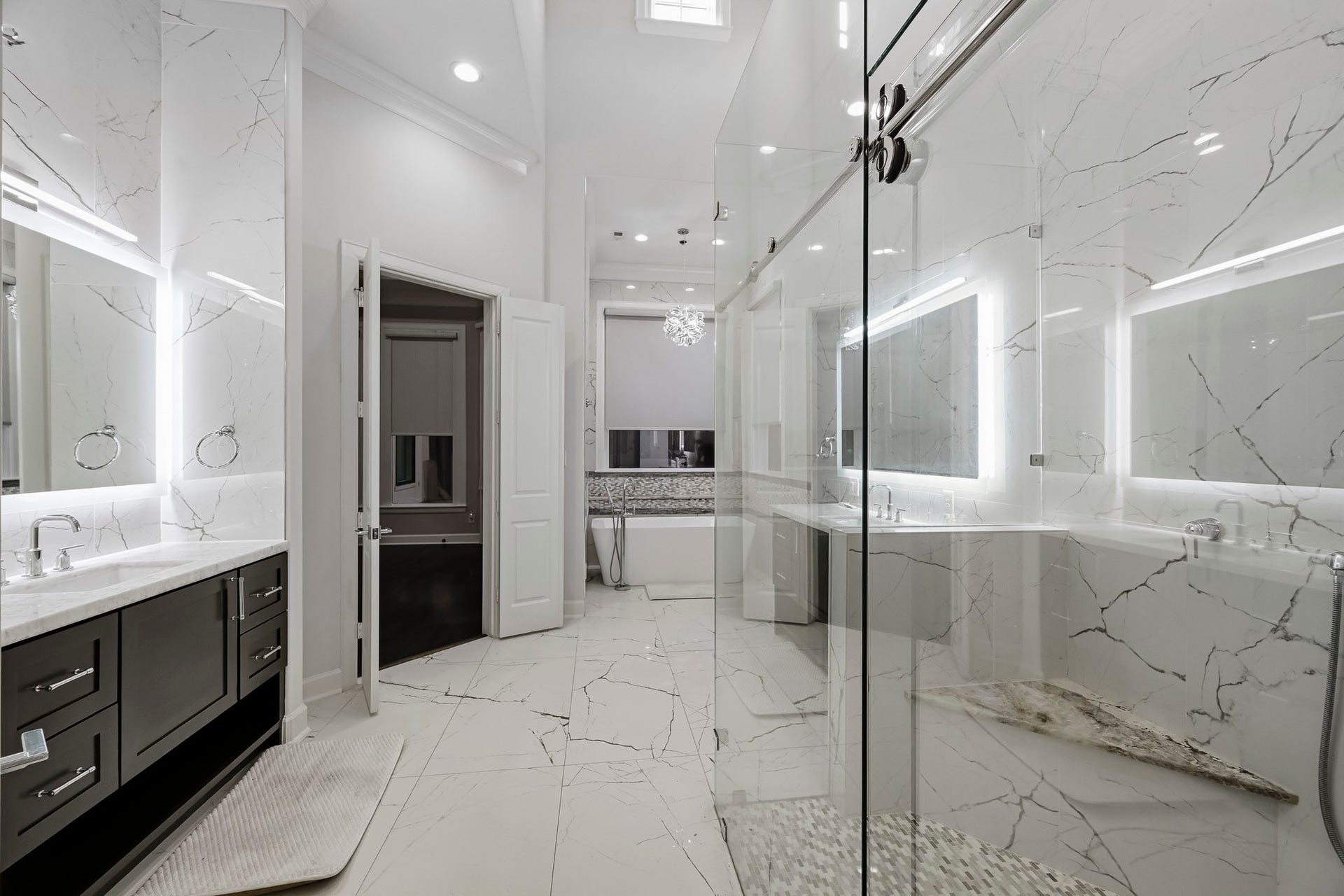 Primary bathroom leads into the huge walk in closet.