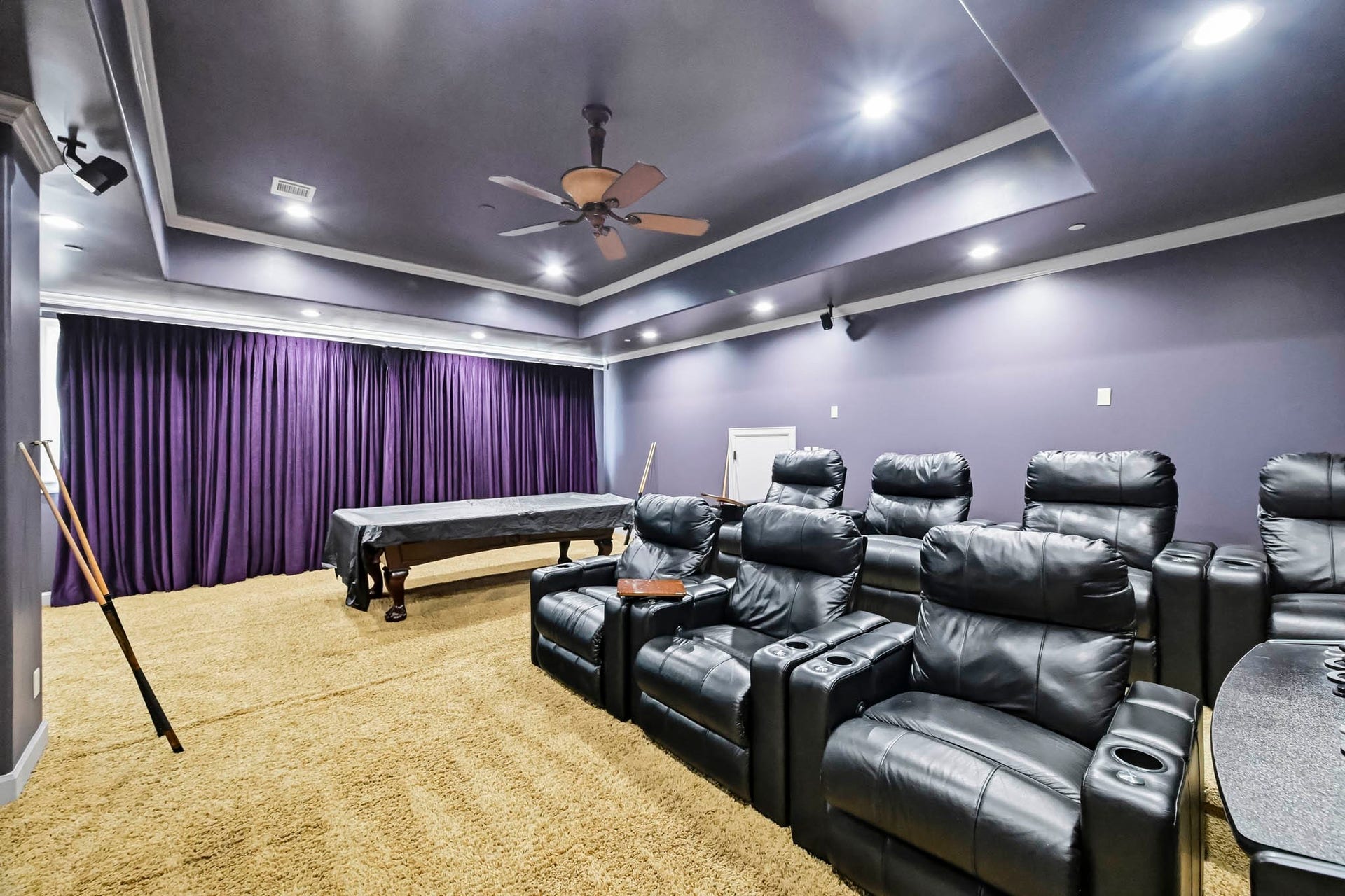 Luxurious home theater with ambient lighting.