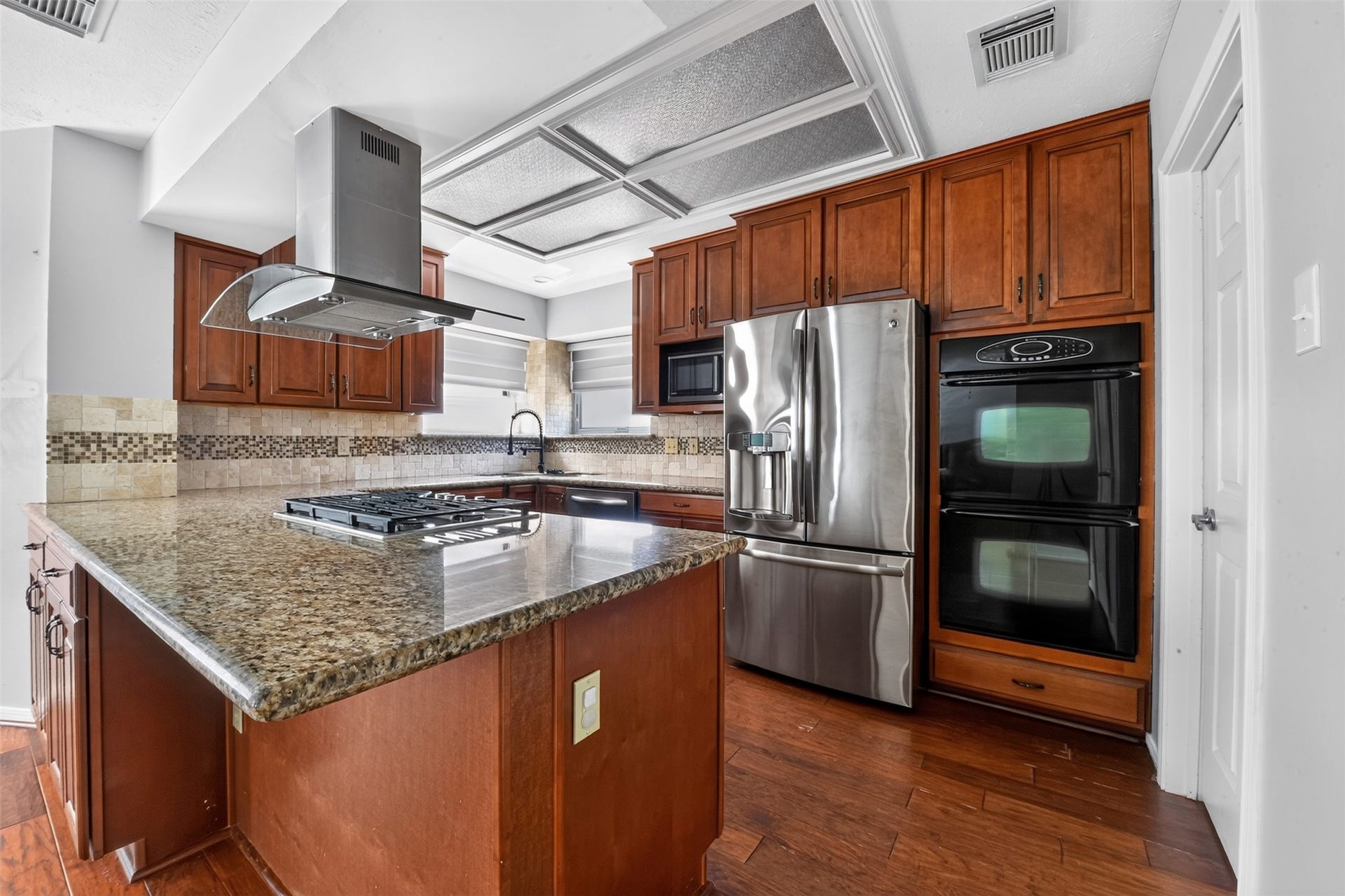 Kitchen has double ovens plus a built in microwave.