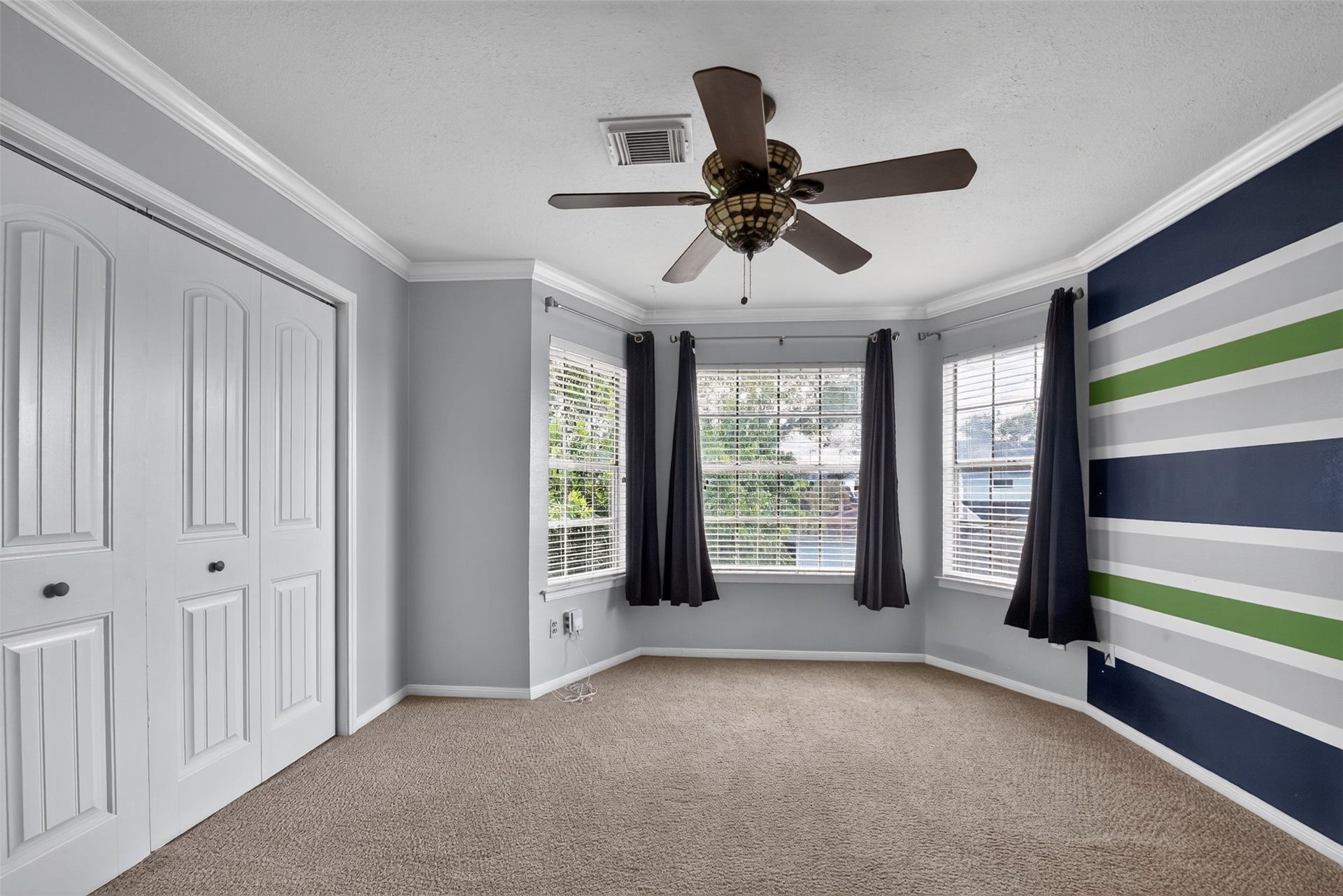 At the top of the stairs, is your flex room.  Use it as a spacious bedroom or as a game room.