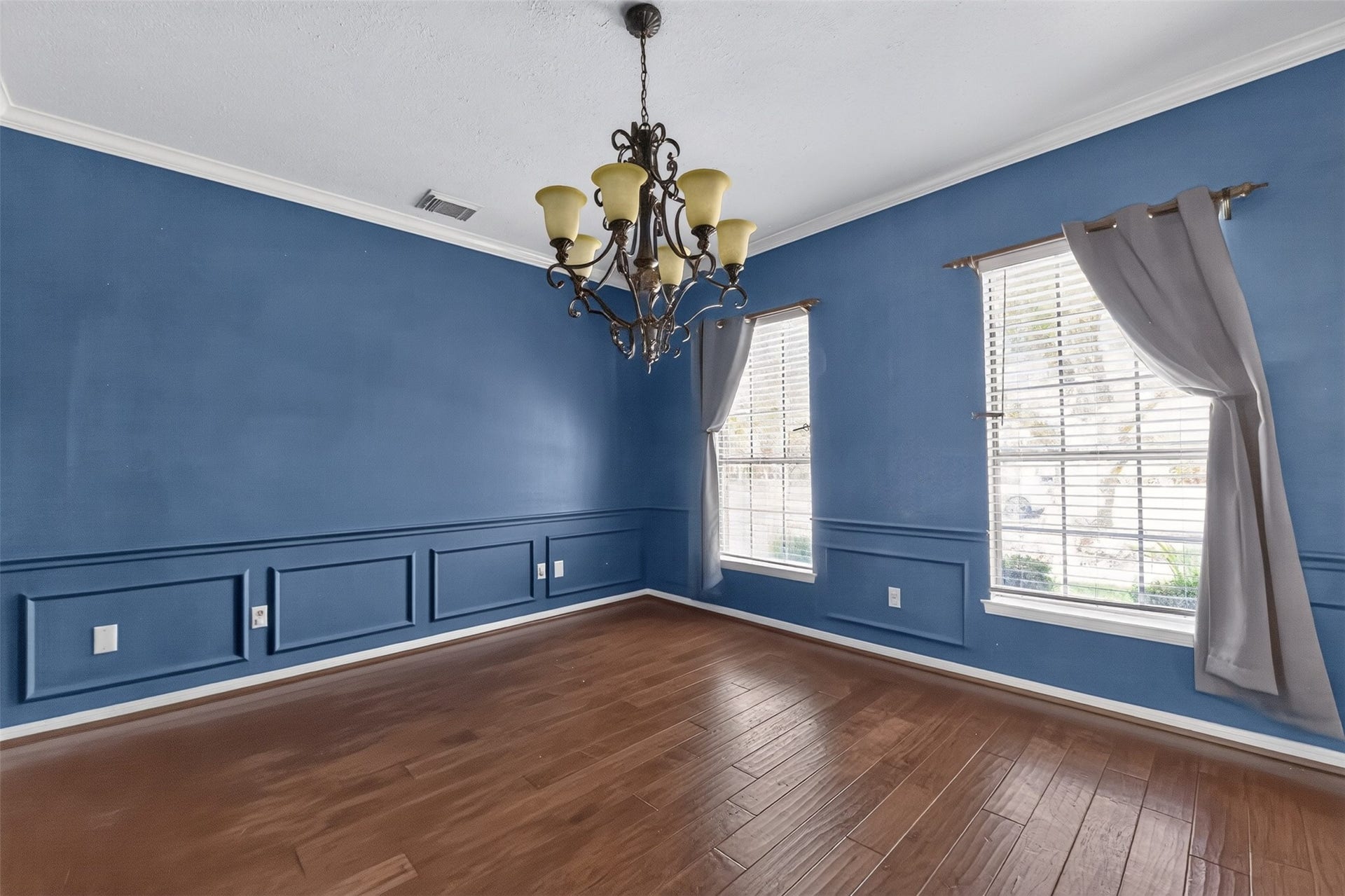 Chair rail and crown molding add a touch of sophistication to the formal dining room.