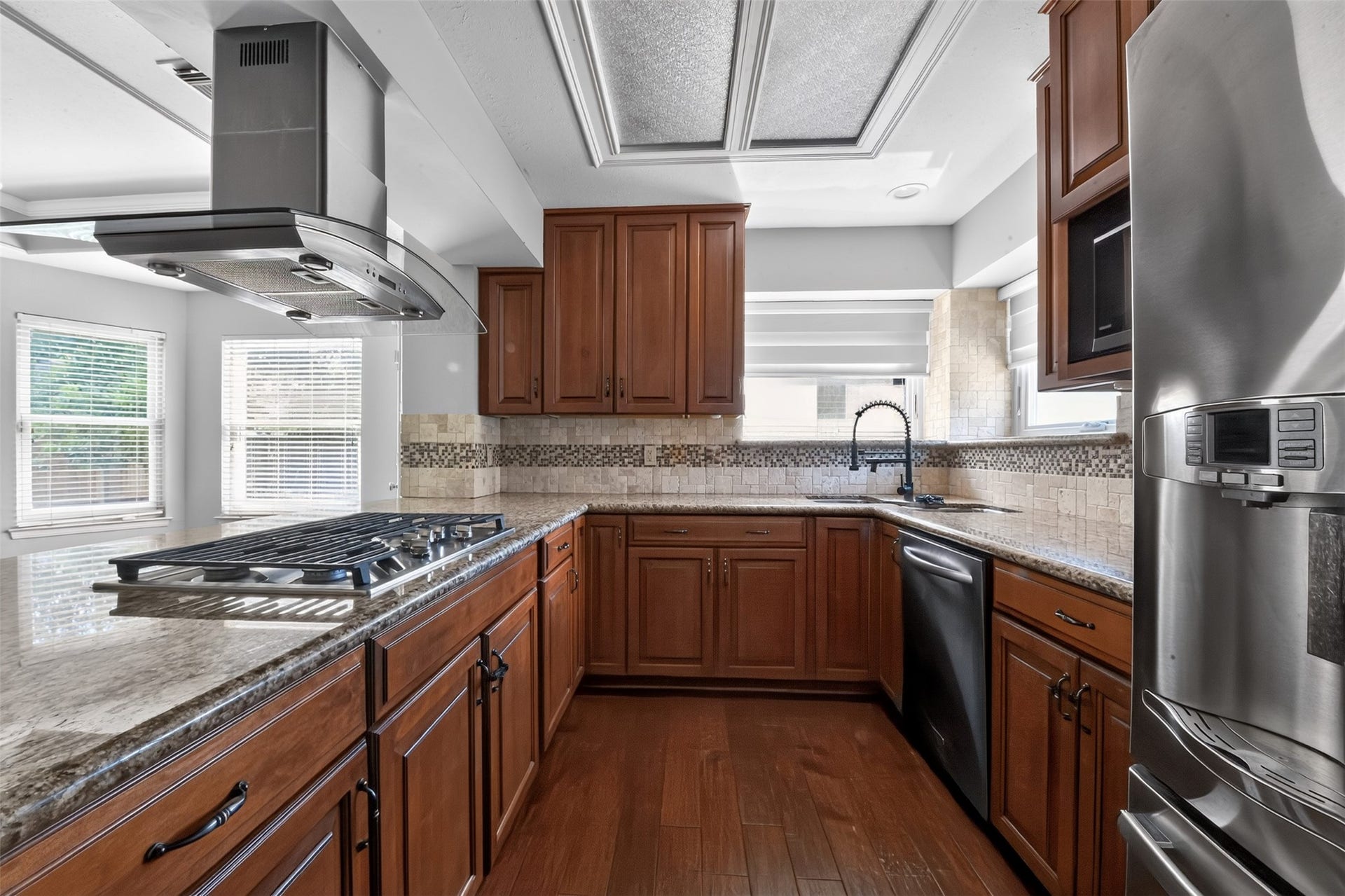 The kitchen has been updated and has granite counters and a gas cooktop
