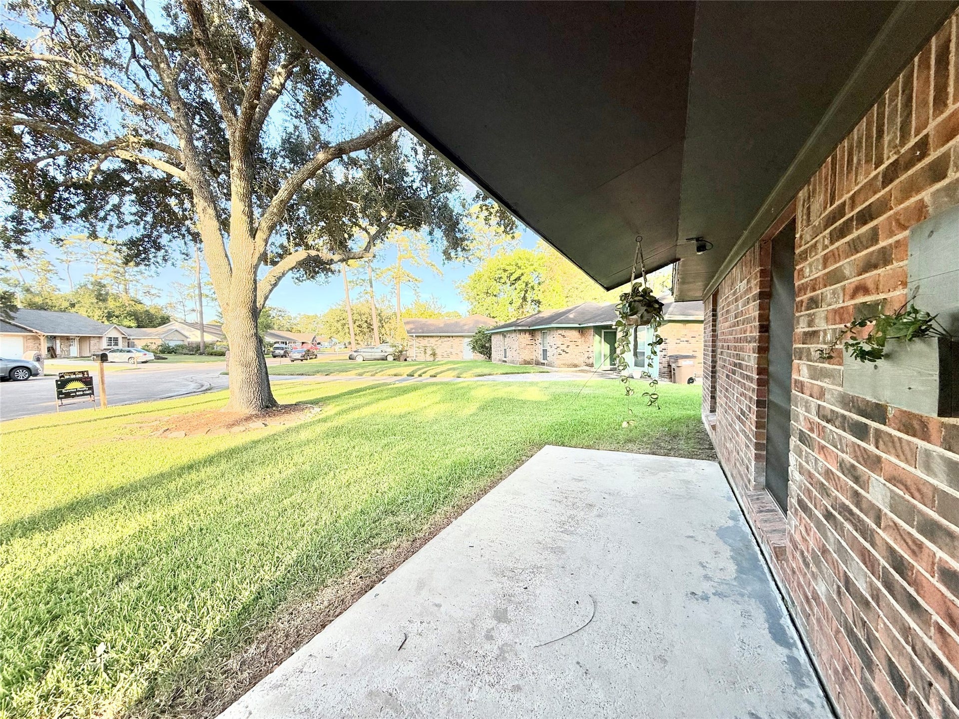 2133 Greenlee Lane, Dickinson, TX 77539 Covered front patio area just waiting to be lined with a bench and flowers