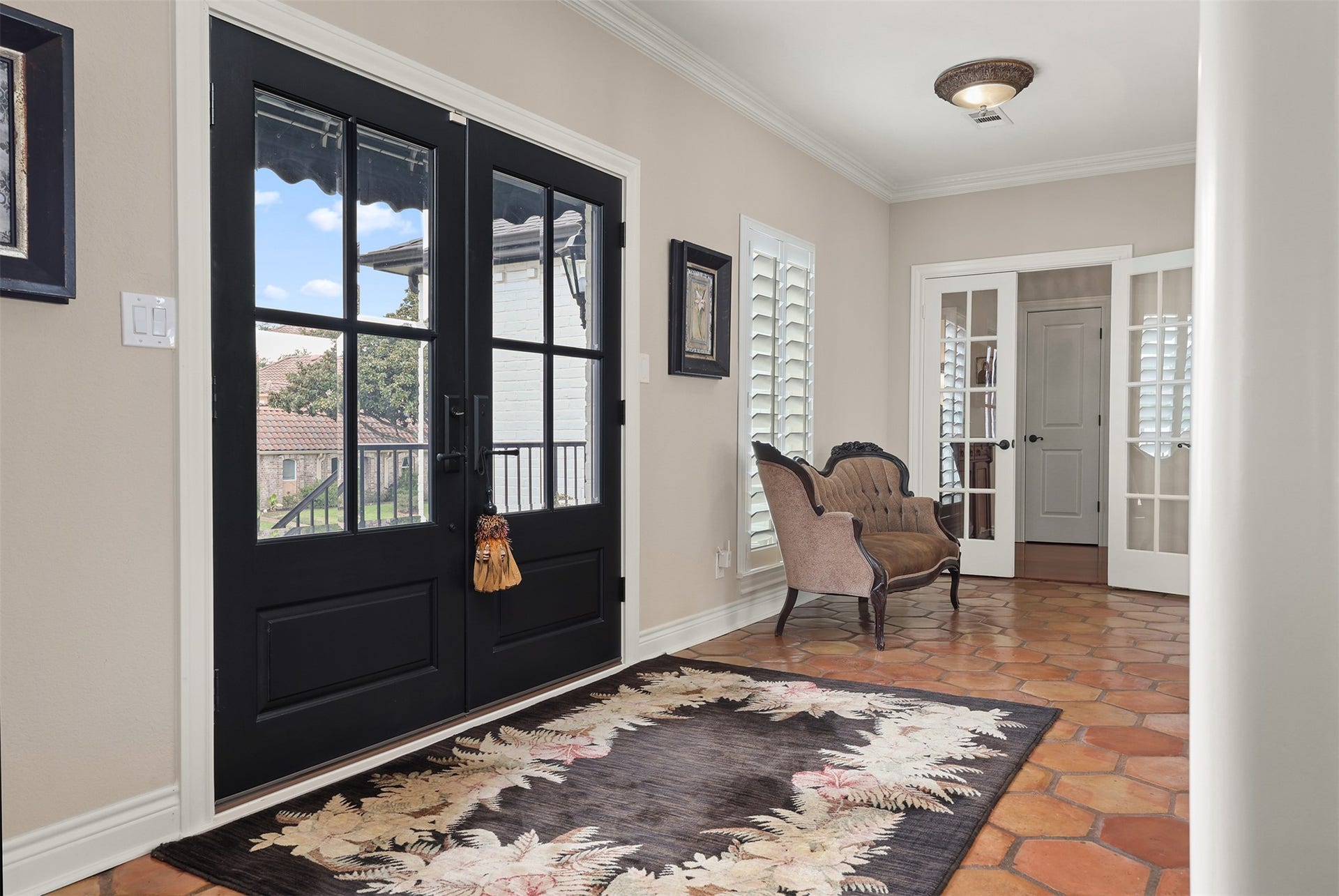 18607 Point Lookout Drive, Nassau Bay, TX 77058 Step inside through elegant black double French doors into a welcoming foyer.