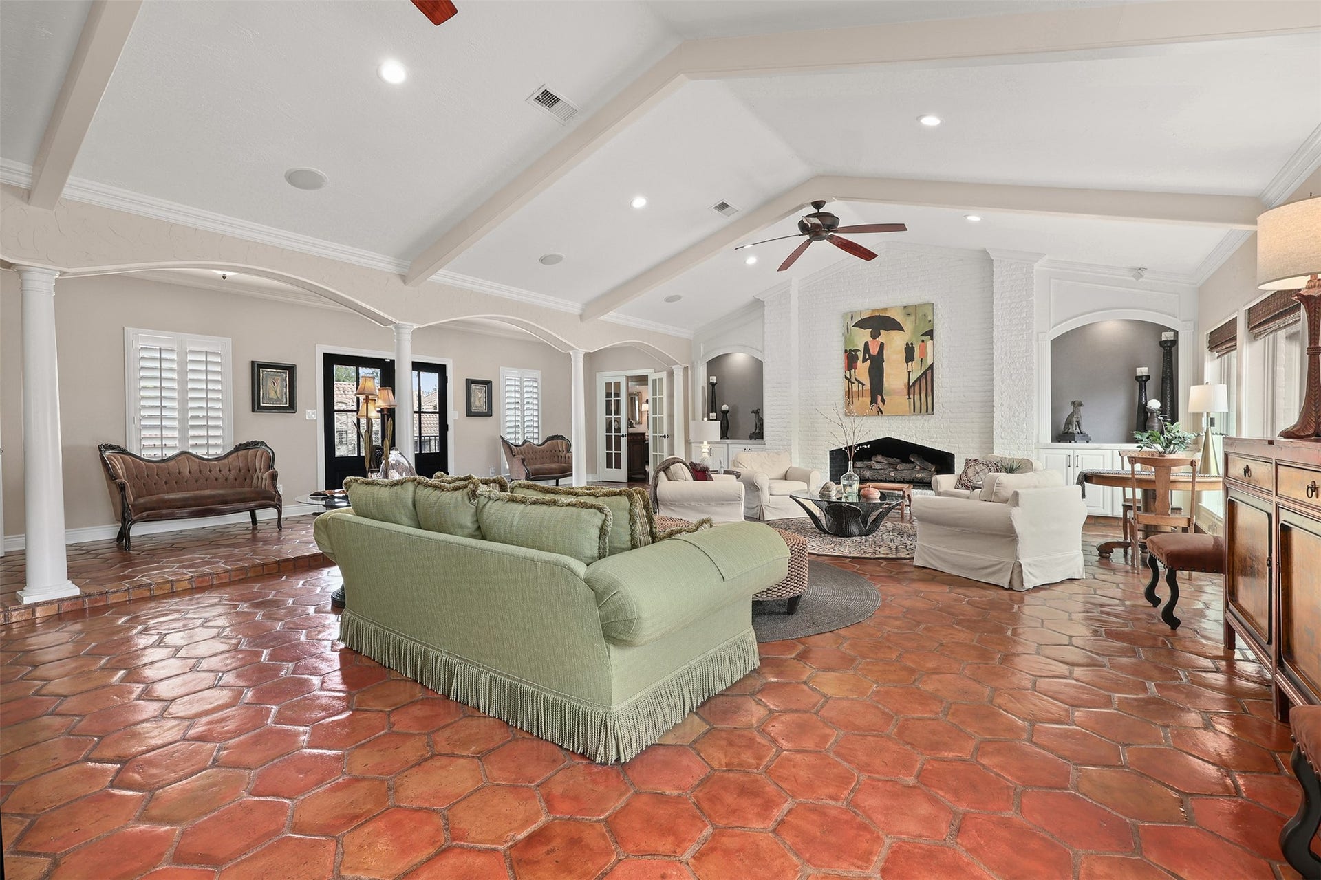 18607 Point Lookout Drive, Nassau Bay, TX 77058 View from the kitchen and breakfast room overlooking the spacious main living area, with a hallway in the distance leading to the private bedroom wing.